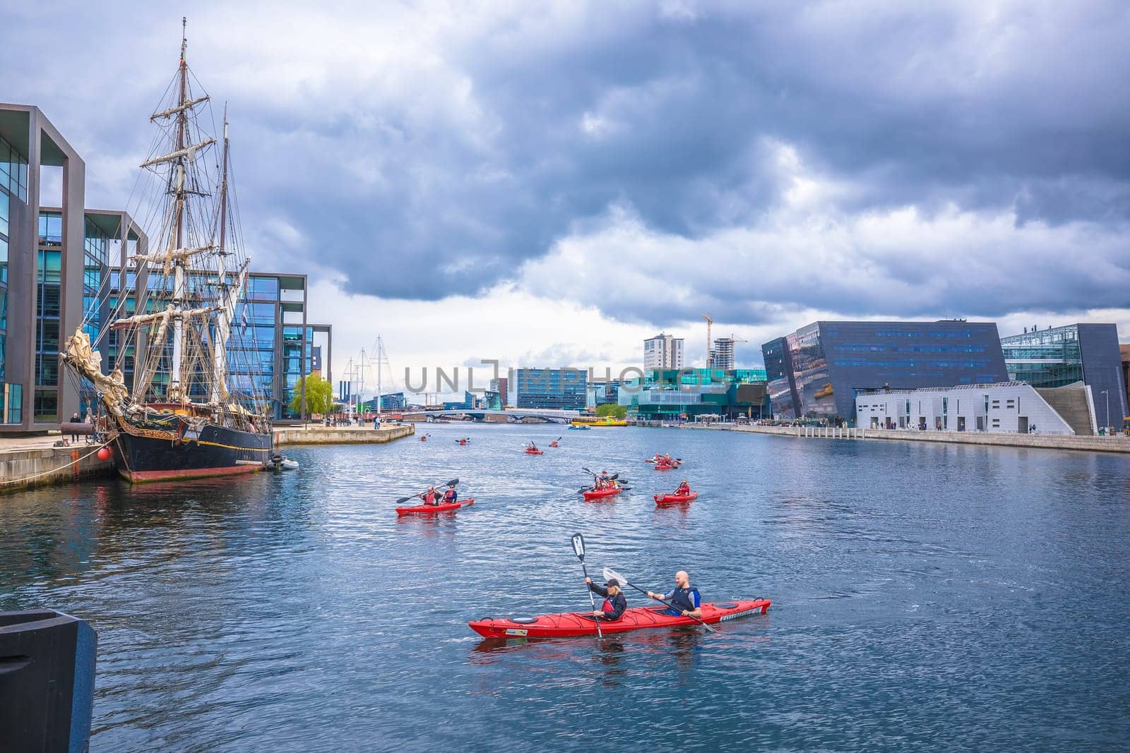 Copenhagen, Denmark, August 29 2023: People kayaking in canal in Copenhagen, capital of Denmark. Water recreation is famous activity in Scandinavian city.