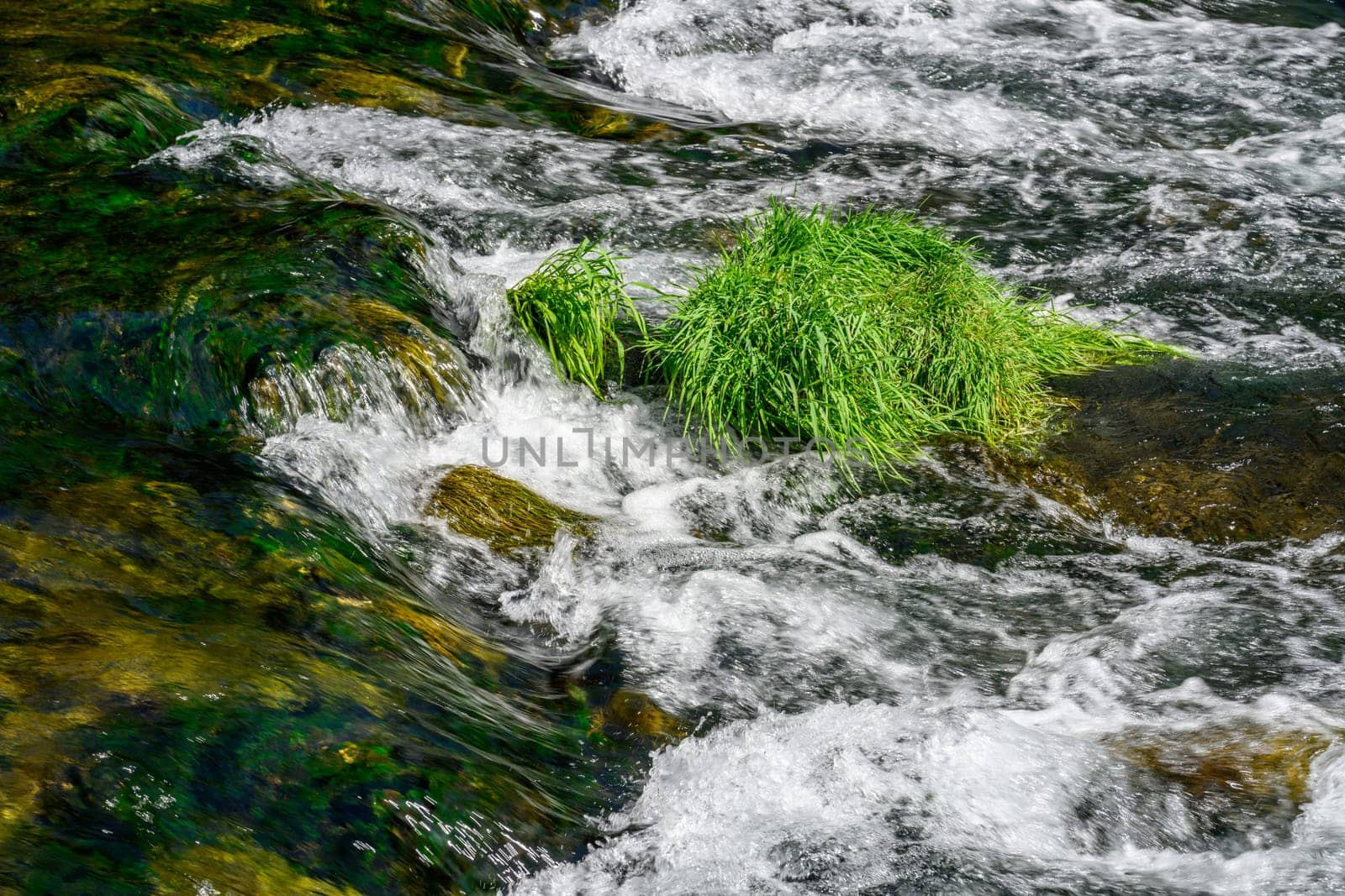 River flowing through rocks photographed with long exposure technique