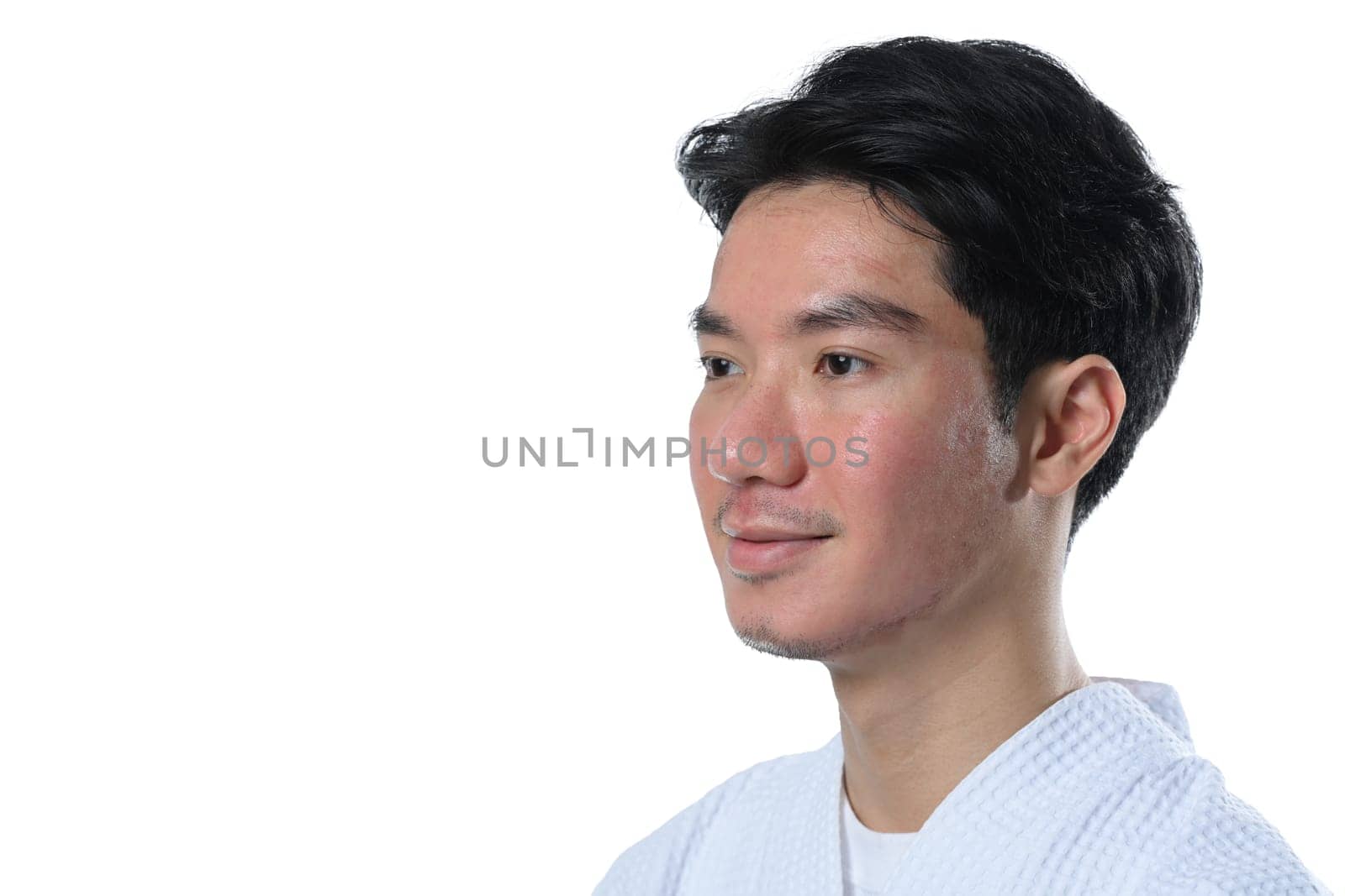 Headshot of attractive man after laser treatment over white background.