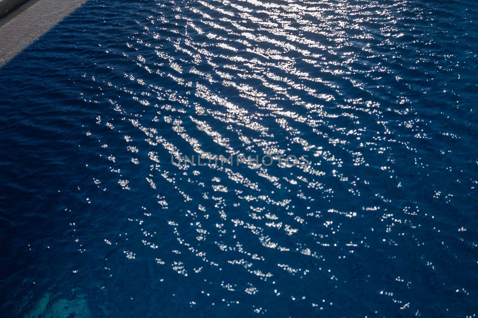 Swimming Pool Surface With Light Reflection and Water Ripple Patterns by Mixa74