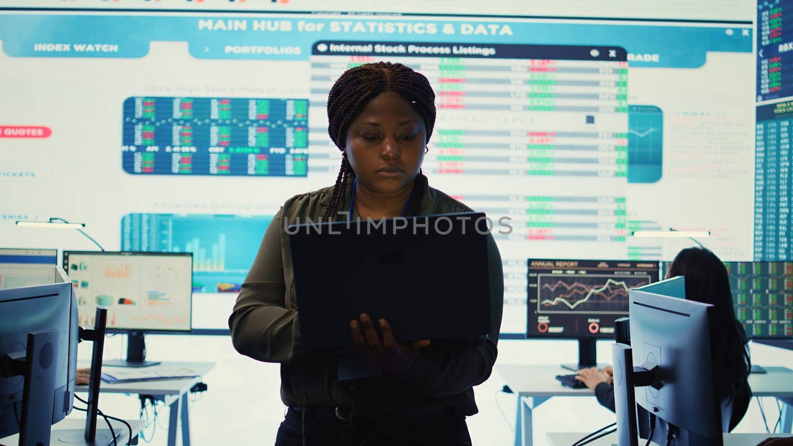 Business analyst looking into statistics and reports to detect any obstacles within the project structure, preparing solutions to ensure productivity. Manager studies numbers. Camera B.