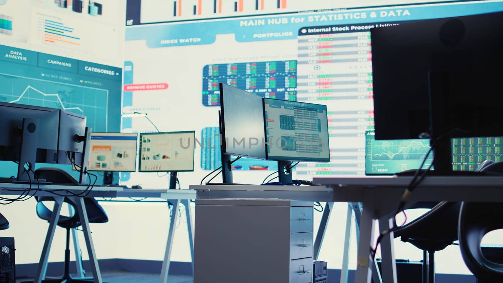 Empty business enterprise control room with a big LED screen used in monitoring organizational statistics and progress. Global firm headquarters used for briefing meetings. Camera B.