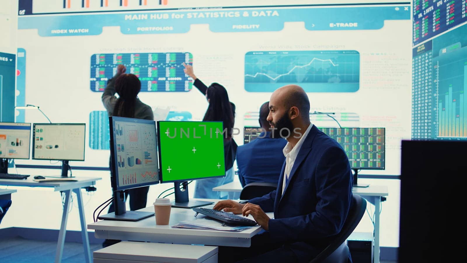 Chief financial officer reviews cost and revenue numbers next to a greenscreen, working on data management study for future improvement. Accountant ensures organizational success. Camera B.