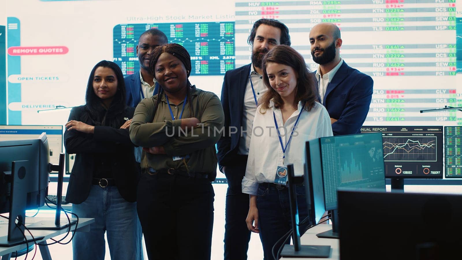Professional forecast affiliates group posing in monitoring room, making crucial decisions together to ensure objectives accomplishment and work on international business expansion. Camera A.