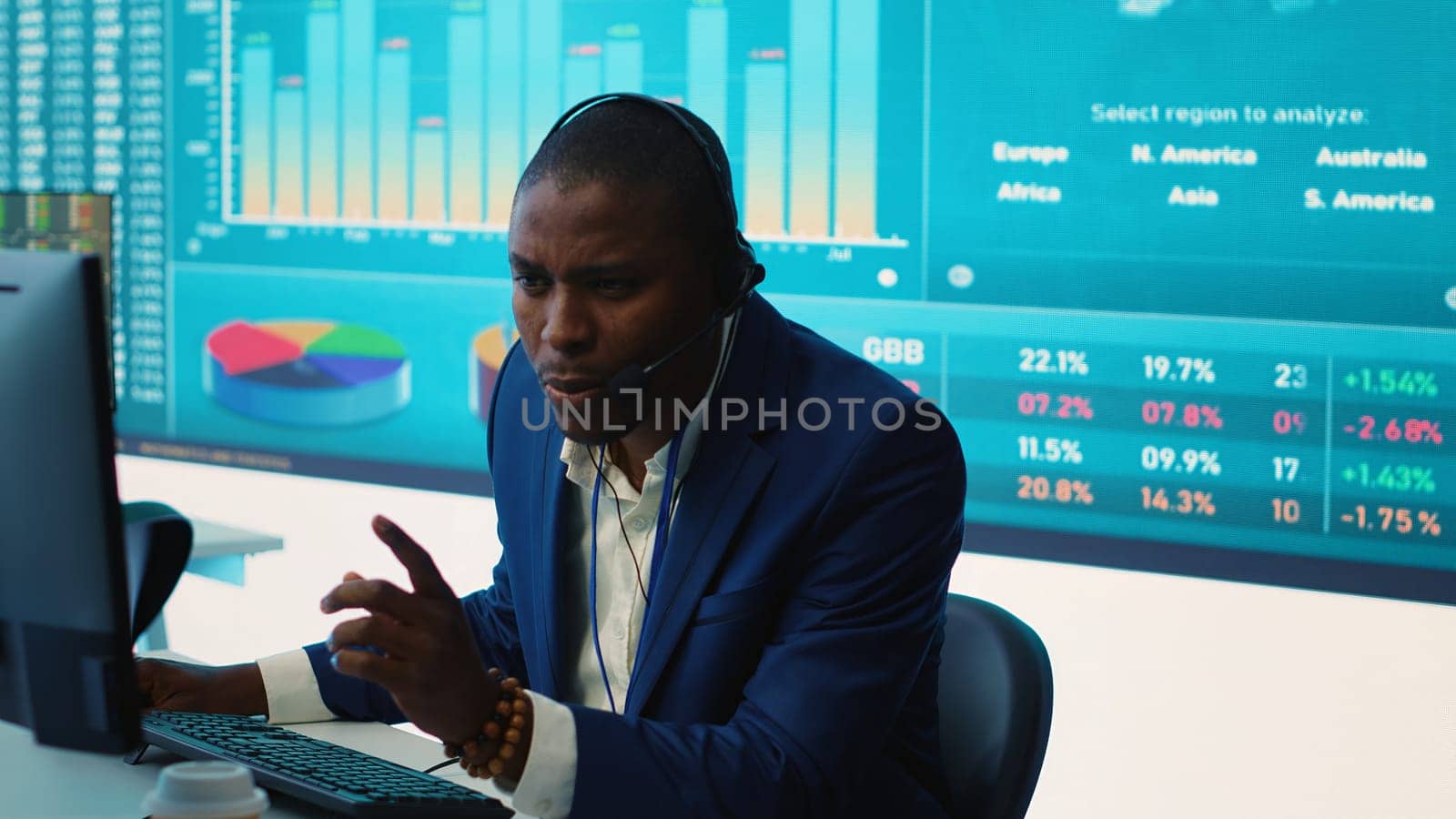 General director examining statistics big data on computer in a control room, makes a briefing report. Business manager studying sales numbers to adapt within market conditions. Camera A.