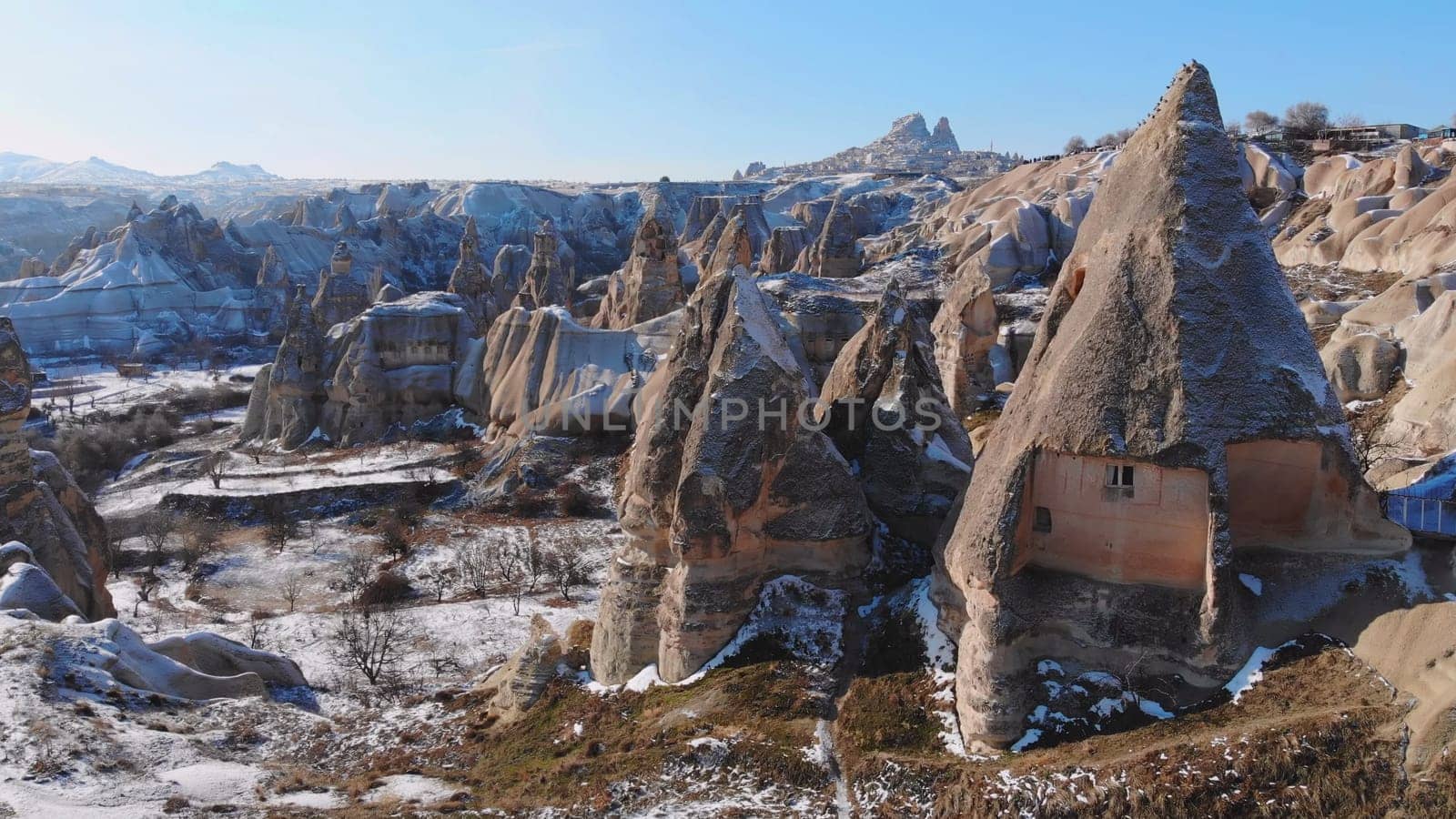 Panoramic view of fairy chimneys in Goreme Historical National Park. Goreme National Park and Rock Sites of Cappadocia, Central Anatolia, Nevsehir Province, Turkey. drone view. Ariel from above, top