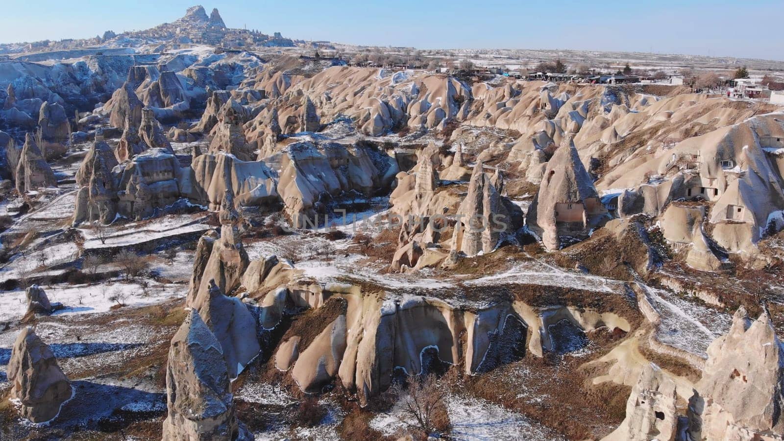 Panoramic view of fairy chimneys in Goreme Historical National Park. Goreme National Park and Rock Sites of Cappadocia, Central Anatolia, Nevsehir Province, Turkey. drone view. Ariel from above, top