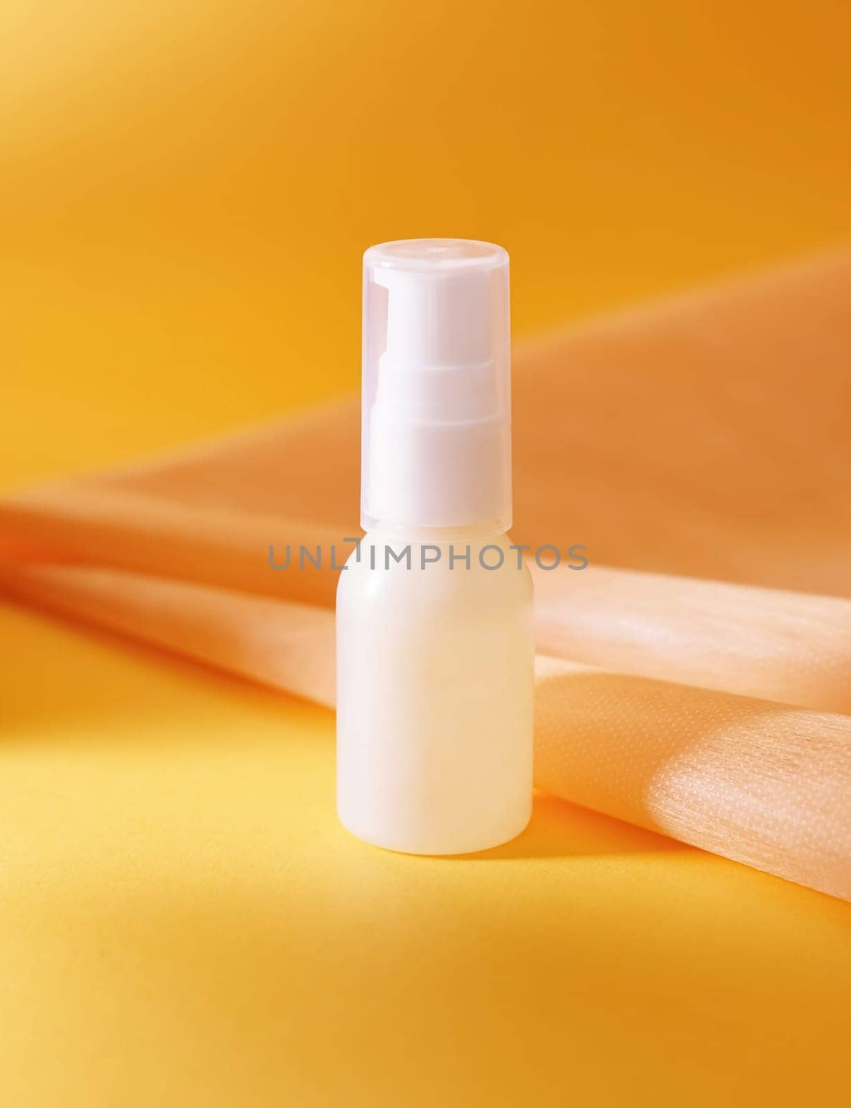 Unlabeled bottle of cosmetic or soap shower gel is displayed on an artistic background, product enclosure for liquid product for promotional and marketing purpose
