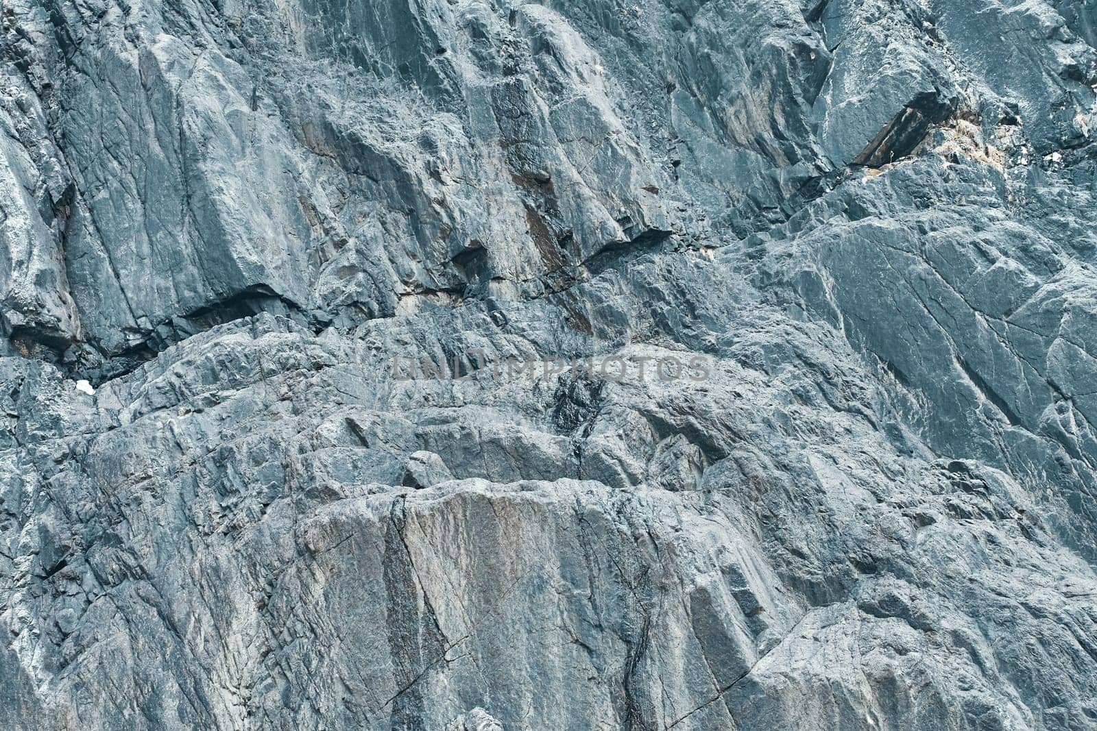 Texture rocks. Fragment of a granite wall.