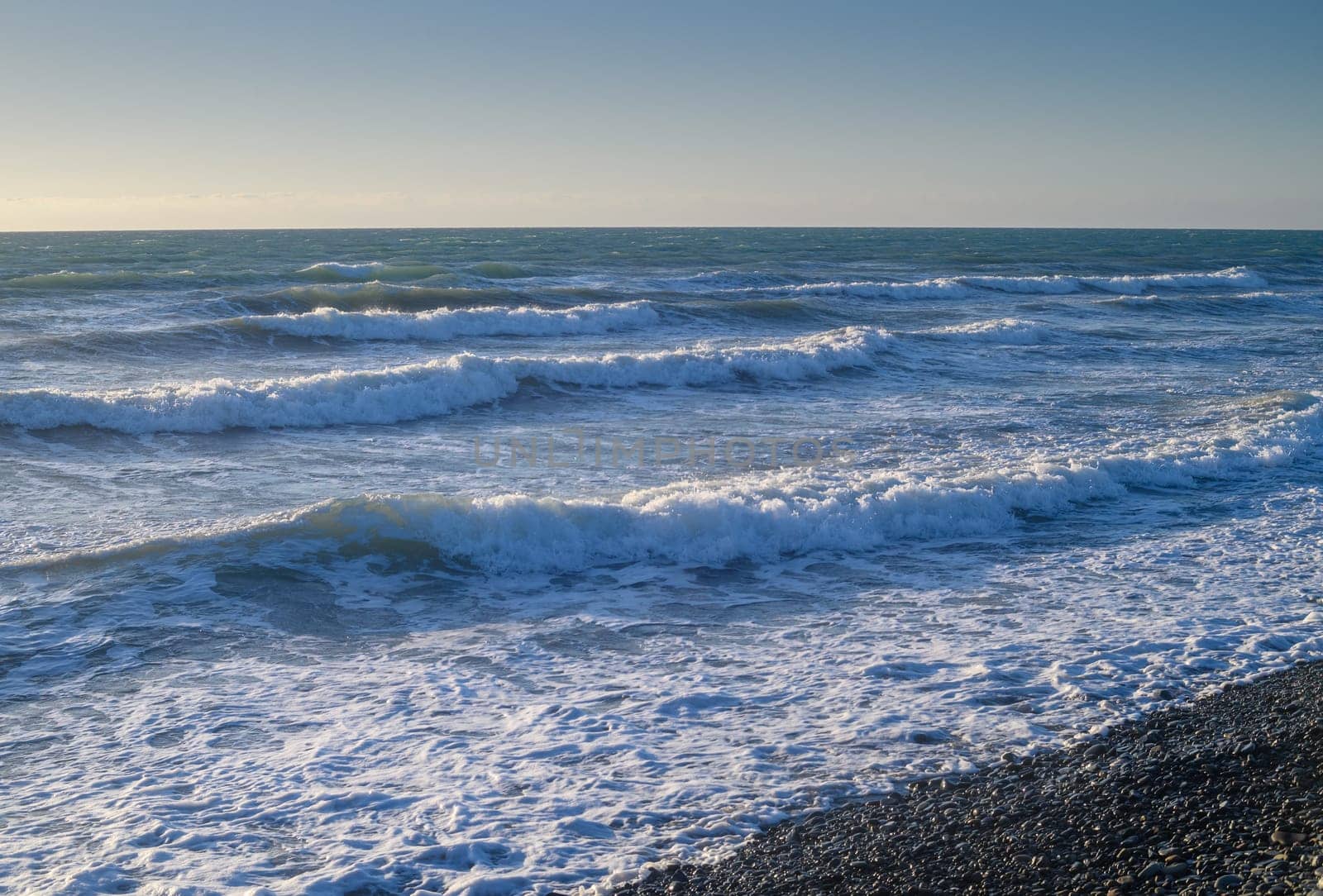 sea ​​foam on the waves of the Mediterranean sea on a summer evening in Cyprus by Mixa74