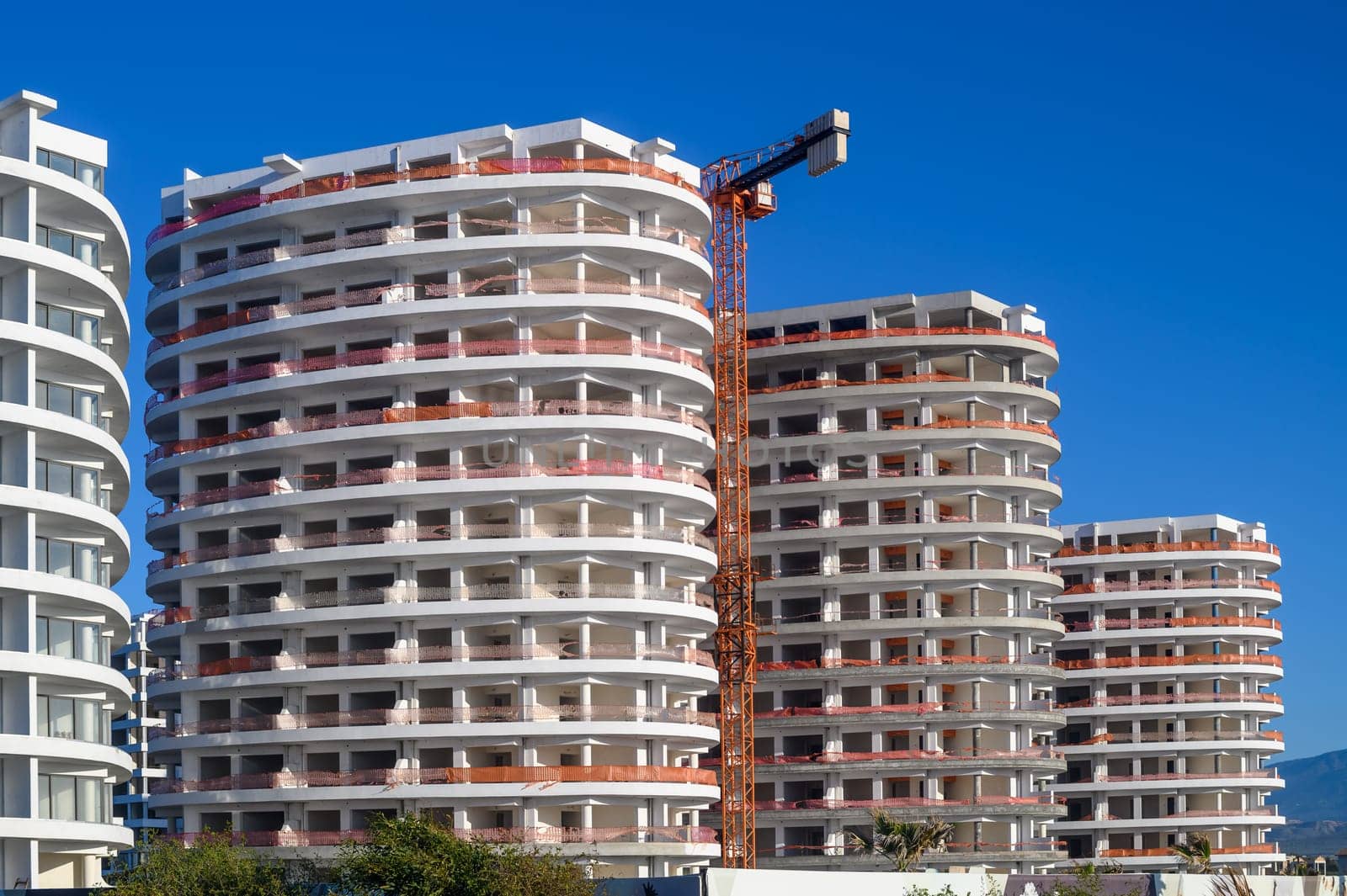 tower crane builds a residential complex near the Mediterranean Sea