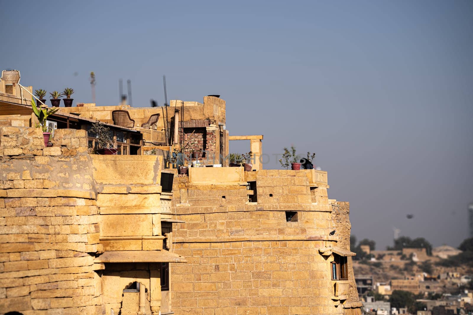 brown sandstone walls of the Jaisalmer Golden fort a popular tourist destination settled by rajput families in the state of Rajastha by Shalinimathur