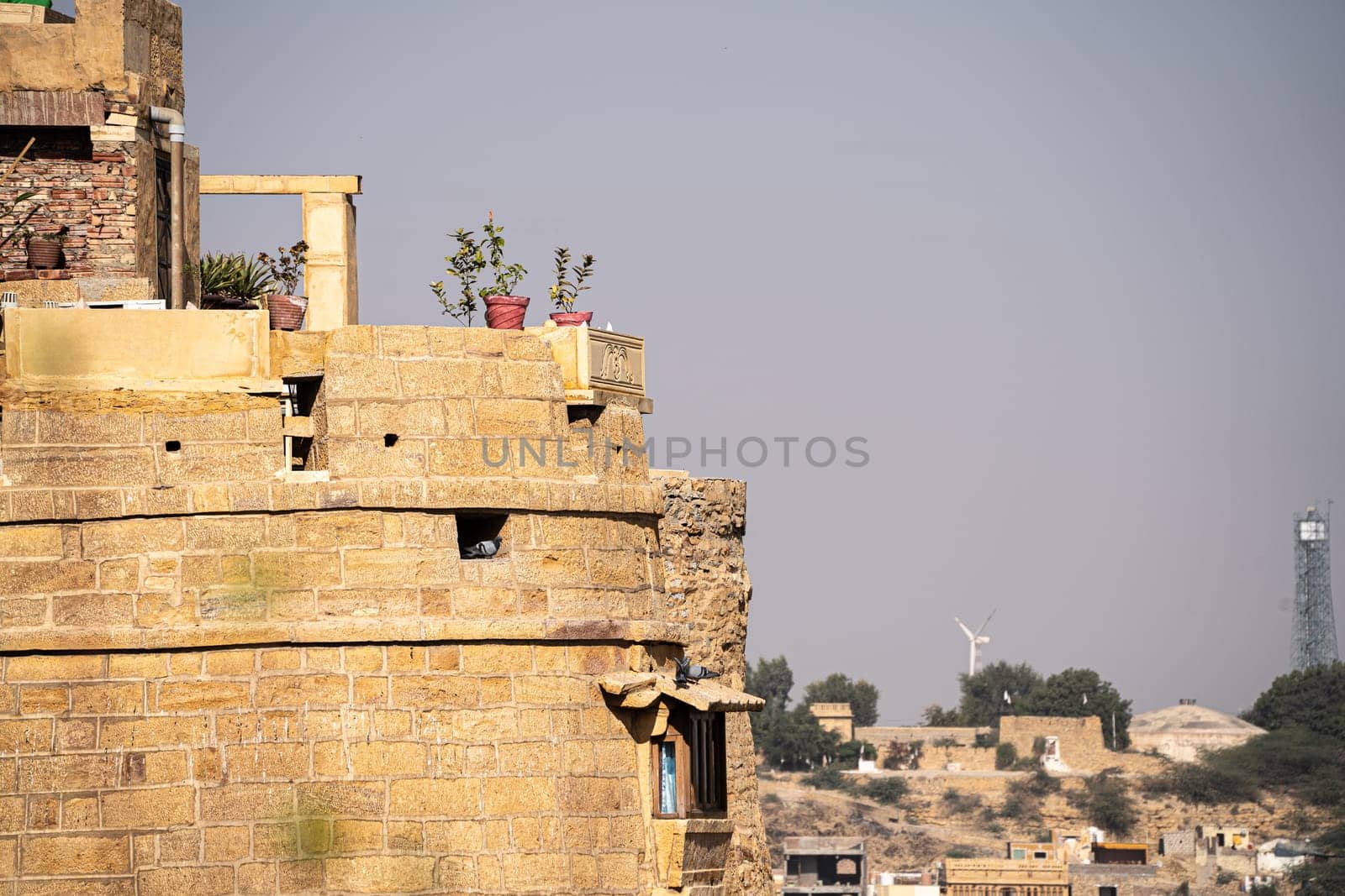 brown sandstone walls of the Jaisalmer Golden fort a popular tourist destination settled by rajput families in the state of Rajasthan India