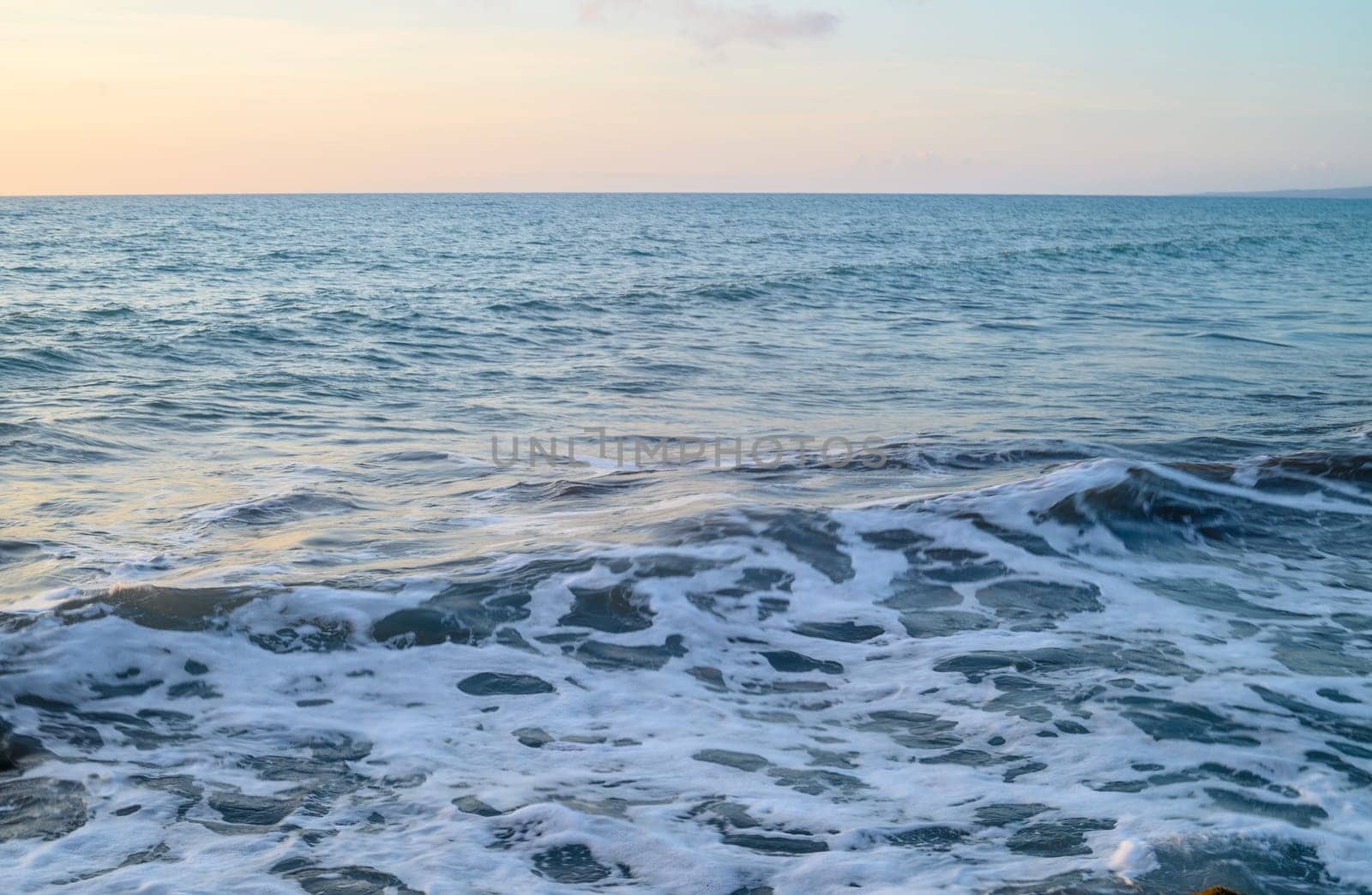 sun glare and radiance on water. sunset seascape with turquoise emerald coloured waves 3