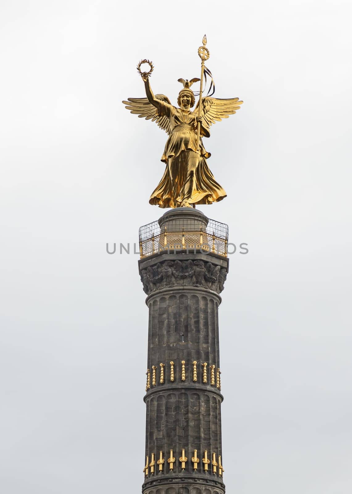 Berlin, Germany - Dec 20, 2023 - Upper part of The victory column with Goddess Victoria to Celebrate Prussia's victory in the Franco-German War in the Tiergarten, One of the most important sights of Berlin and one of the most important national monuments of Germany, Space for text, Selective focus.