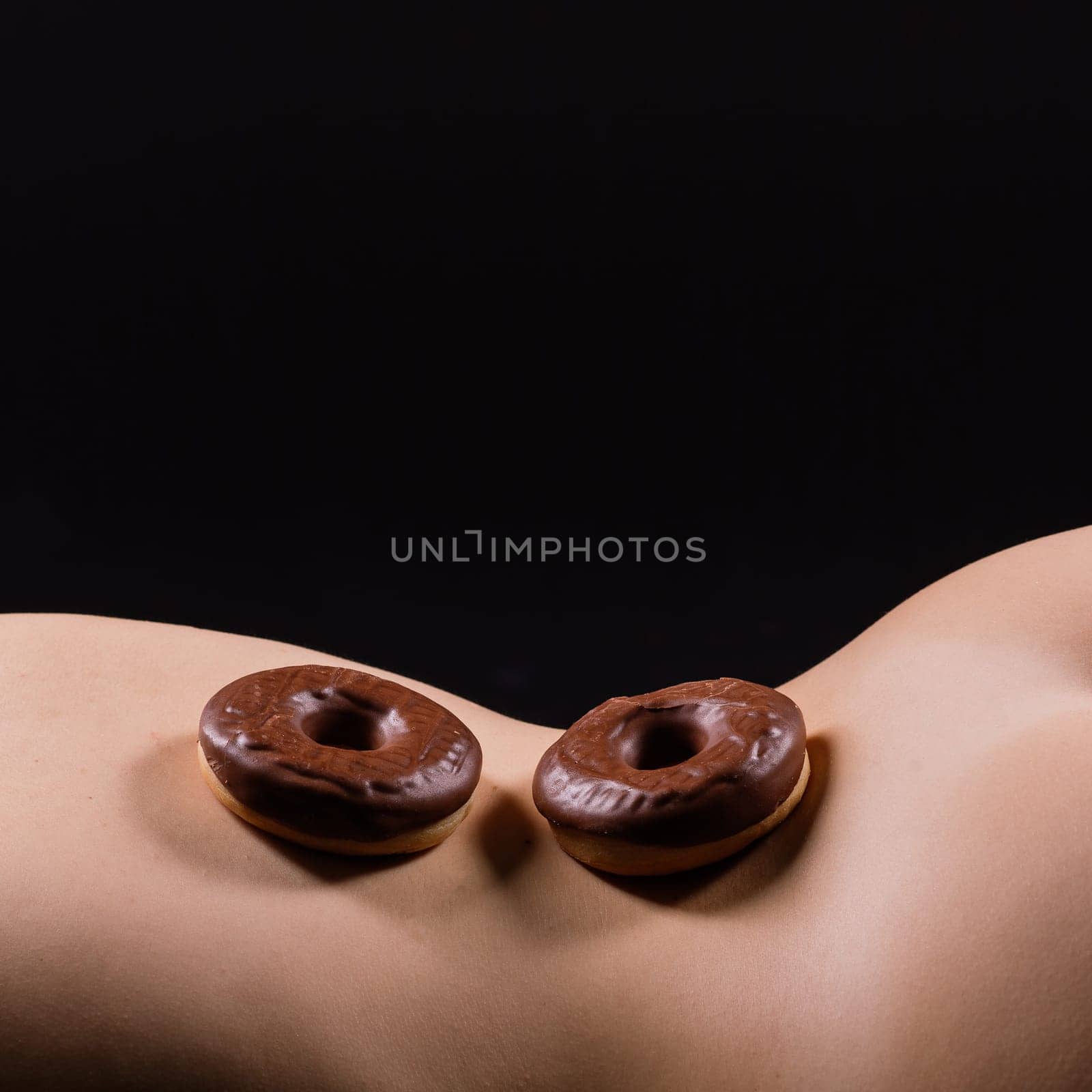 Close up young nice lady woman with slim body perfect skin nude top lingerie stand hold donut