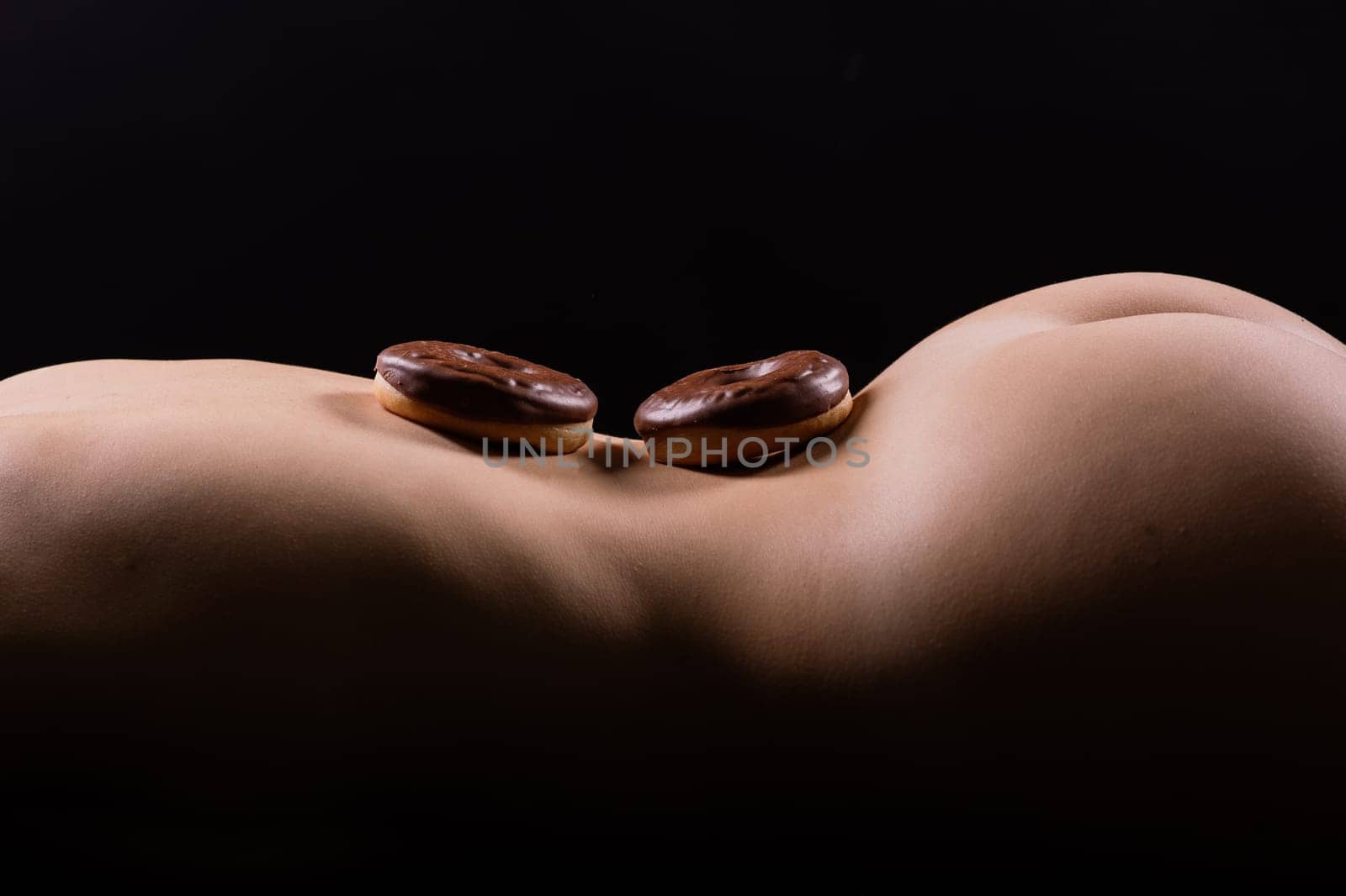 Close up young nice lady woman with slim body perfect skin nude top lingerie stand hold donut