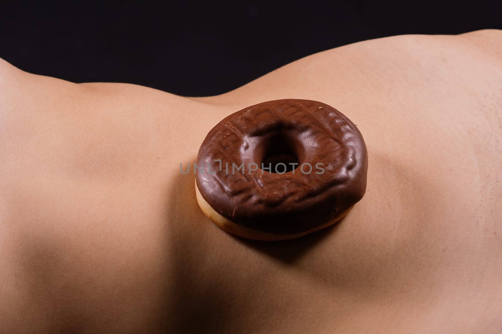 Close up young nice lady woman with slim body perfect skin nude top bra lingerie stand hold donut by Zelenin