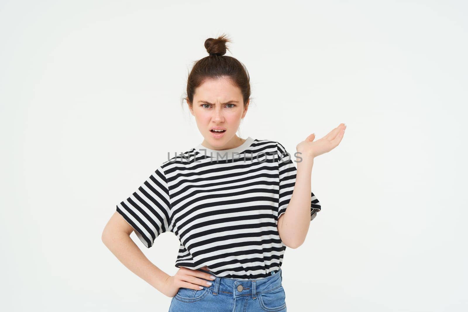 Portrait of angry woman complaining, raising one hand and shrugging looking frustrated, waiting for explanation, doesnt udnerstand smth, standing over white background by Benzoix