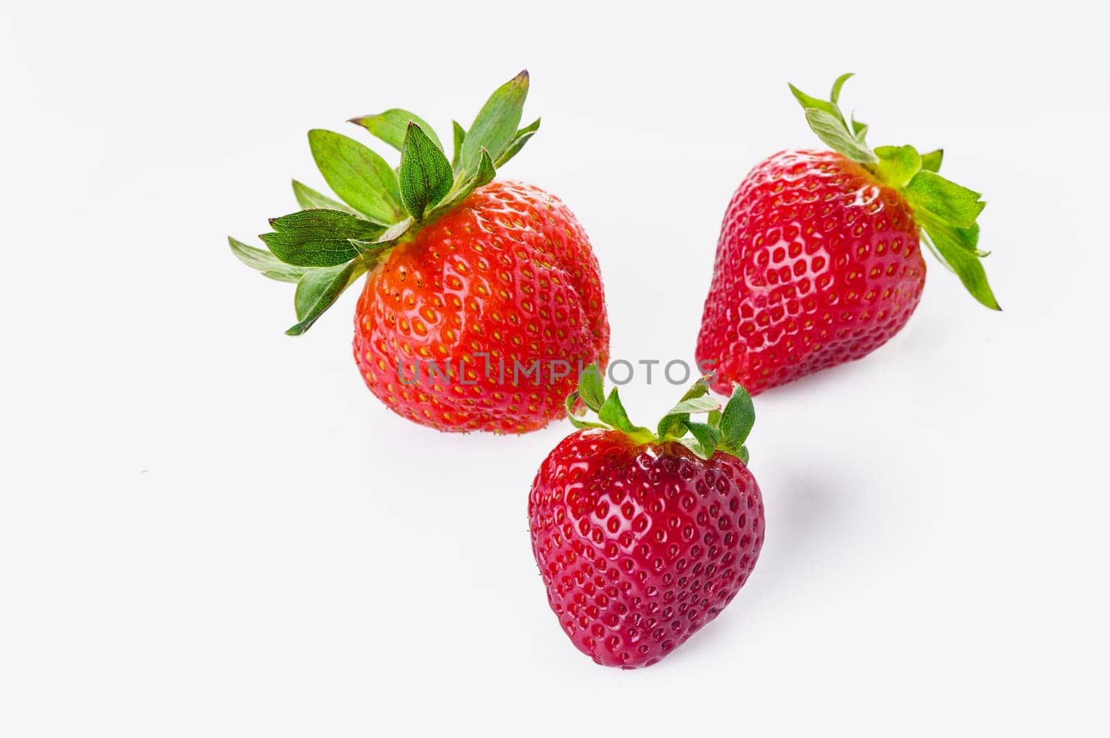 Group of Fresh Strawberries on White background Isolated 1 by Mixa74