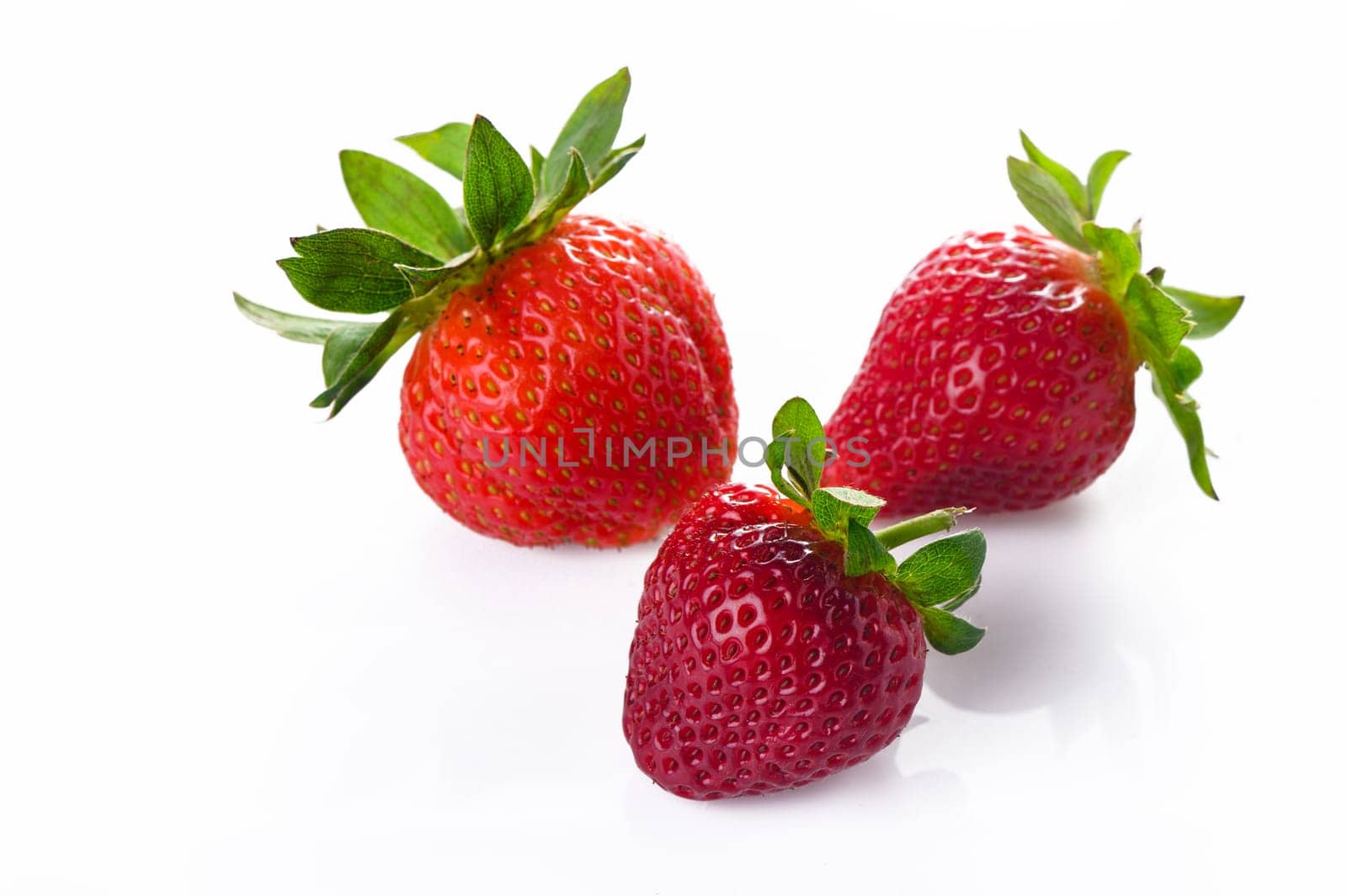 Set of ripe strawberries. Whole and cut berries isolated on white background. by Mixa74