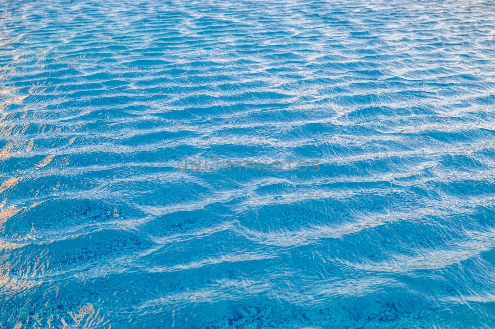Beautiful sun reflections of water in the pool. Summer. Flight holidays. 3