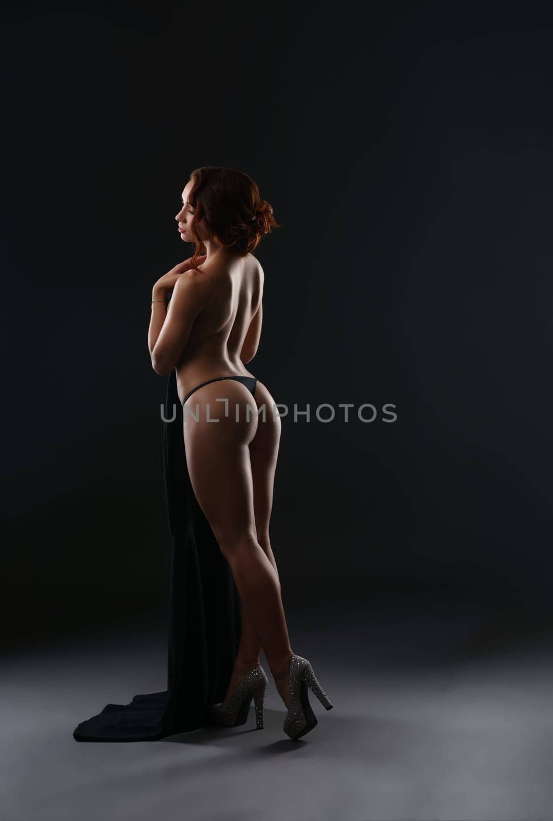 Nude. Girl posing topless with her back to camera by rivertime