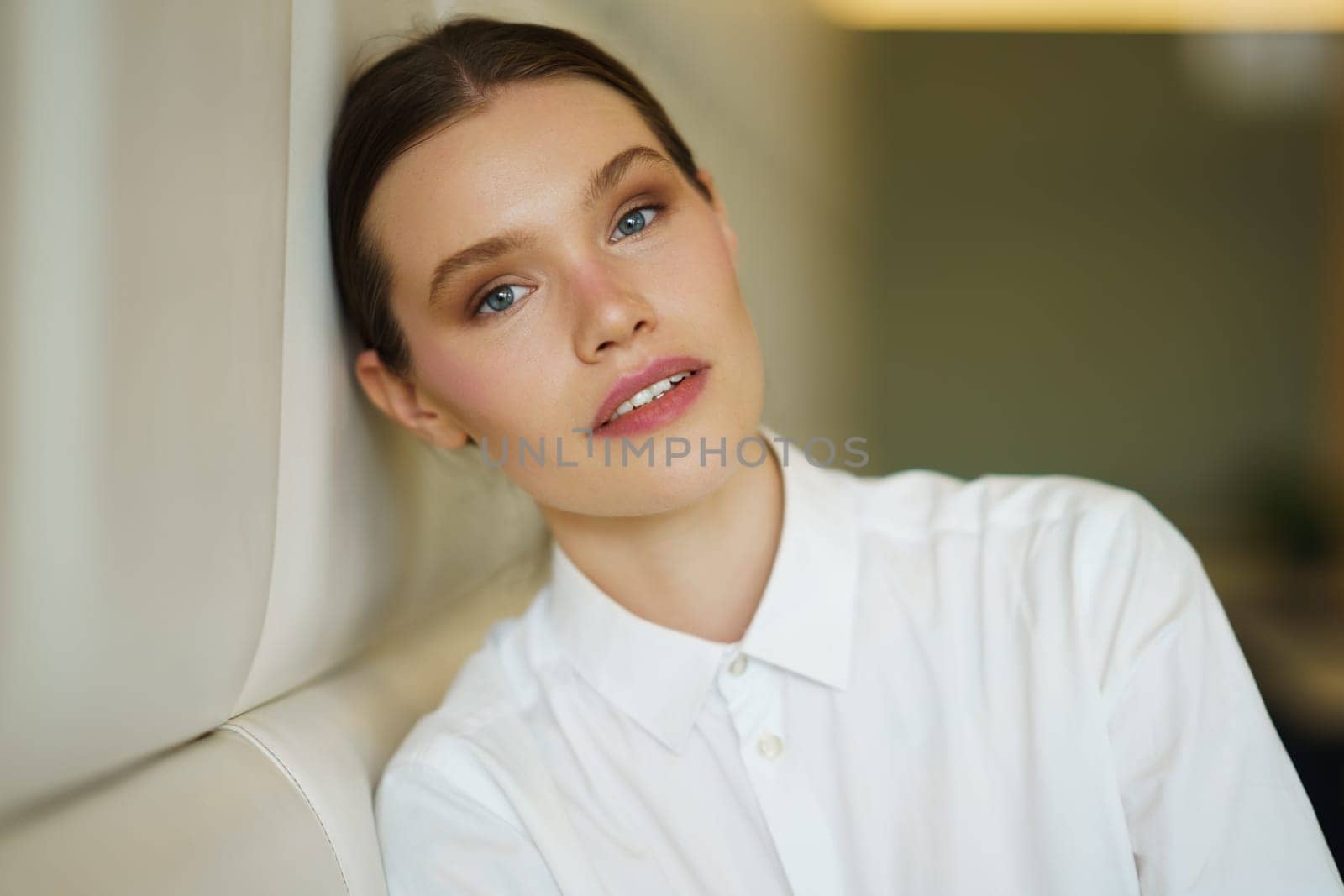 Beauty businesswoman leaning the head on a cafeteria by javiindy