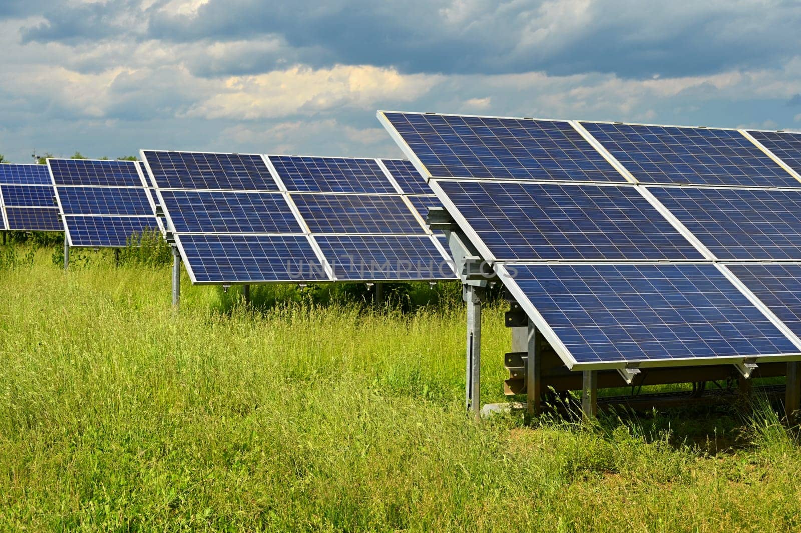 Solar power plant - concept for electricity and ecological industry. High energy prices. Beautiful landscape and sunny day with blue sky. Photovoltaic power plant. by Montypeter