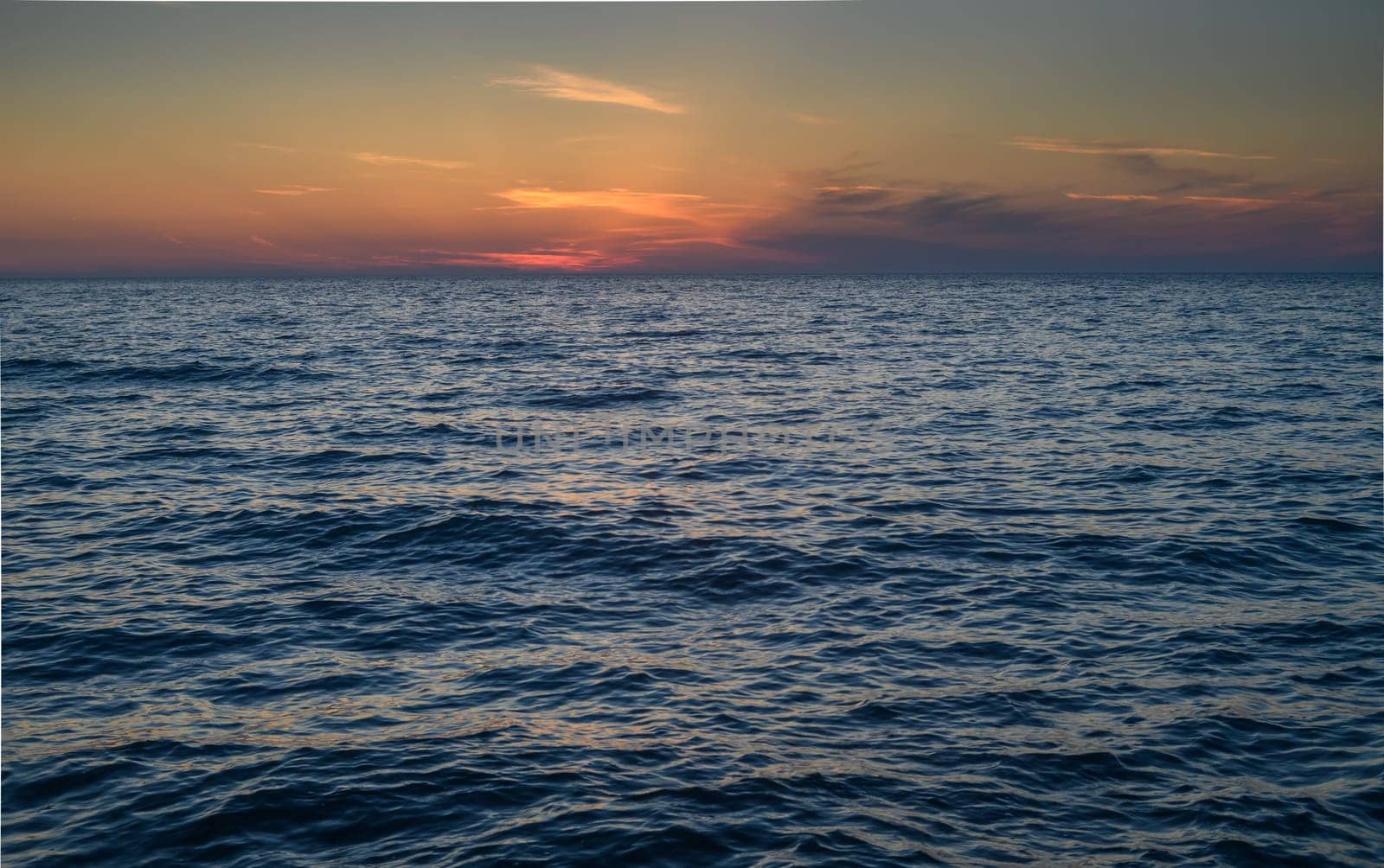 sunset and waves on the Mediterranean coast on the island of Cyprus by Mixa74