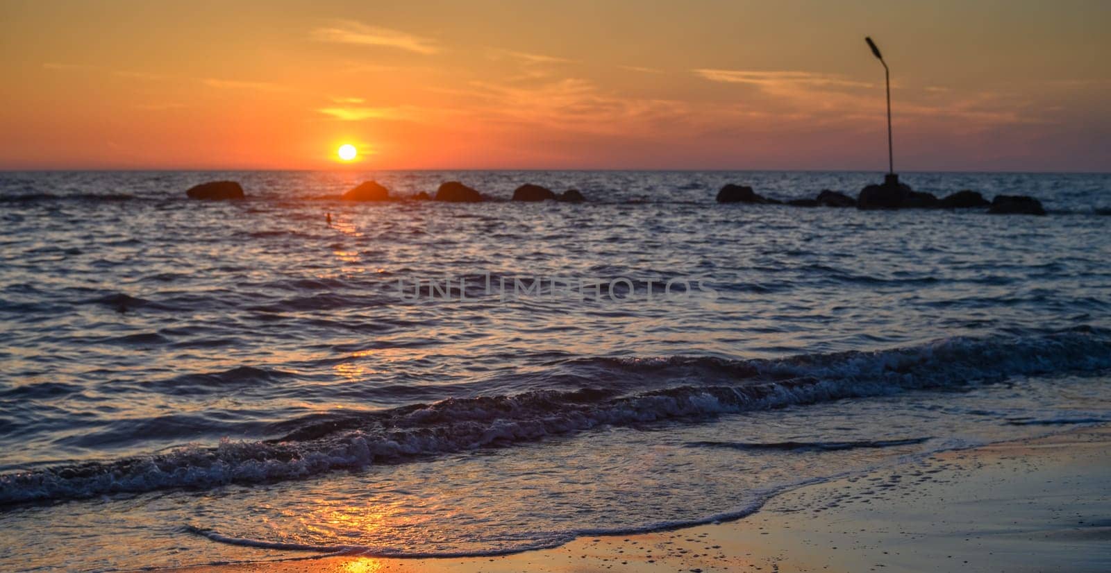 sea, clouds, mountains and waves on the Mediterranean coast on the island of Cyprus at sunset 1 by Mixa74