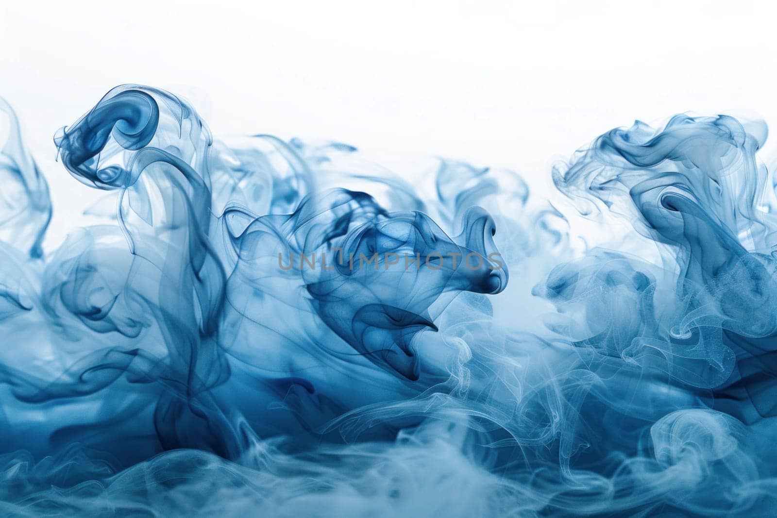 Blue smoke in water on a white background with copy space for travel and art designs