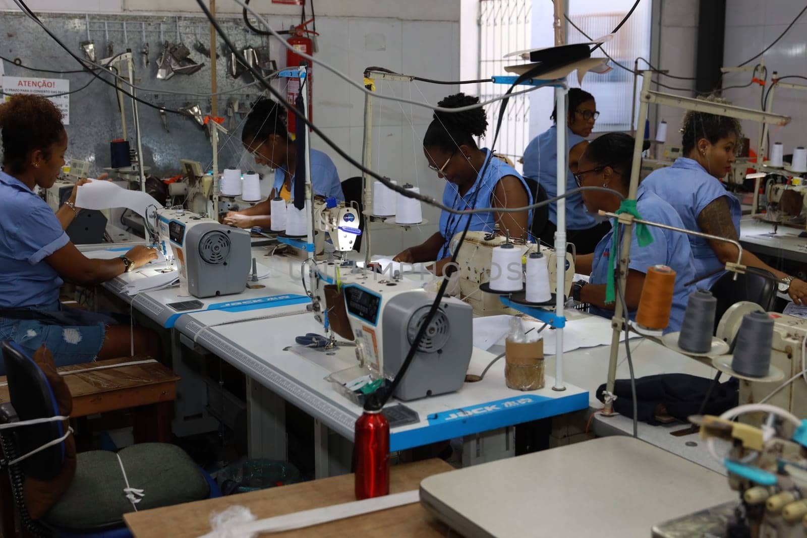 salvador, bahia, brazil - june 7, 2024: seamstress working in a textile factory in the city of Salvador.