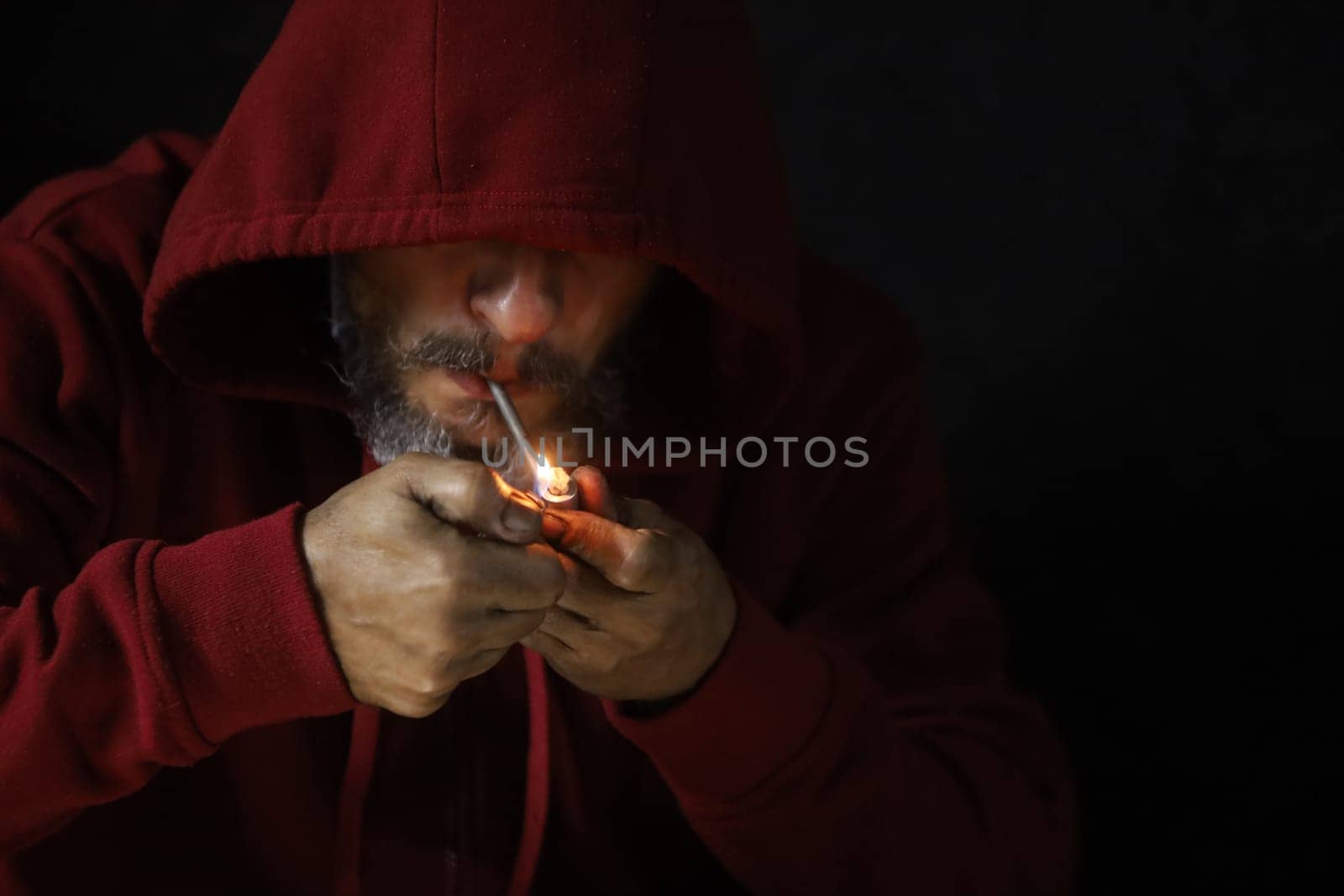 salvador, bahia, brazil - october 10, 2022: Crock user smoking the drug with a metal pipe in Salvador city.