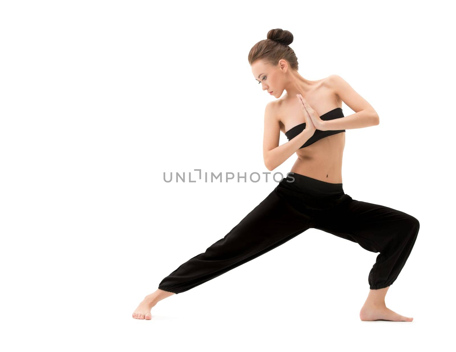 Yoga. Studio photo of beautiful instructor doing asana