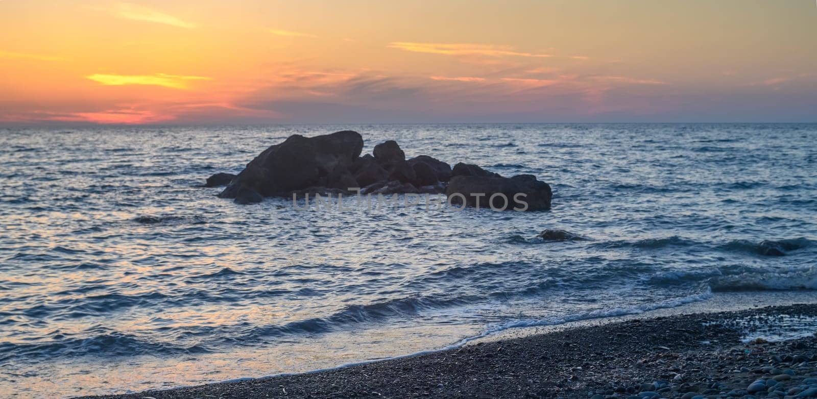 Rock stone stage in nature with sea beach seashore landscape and sunset summer sky 2