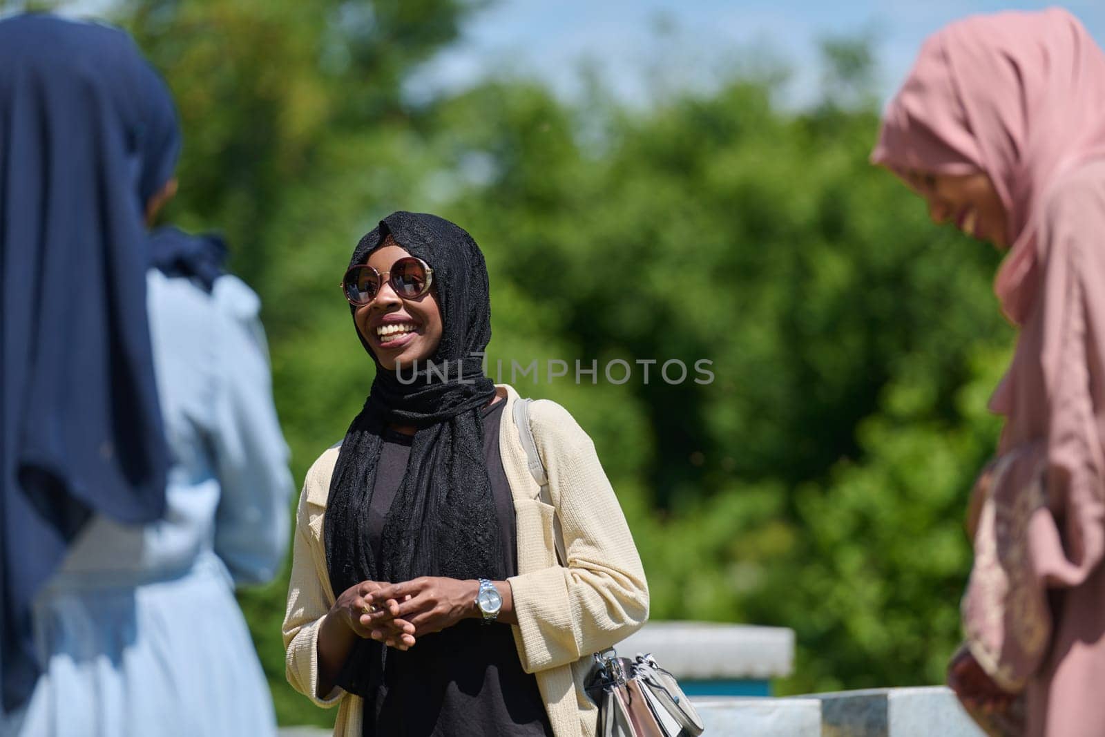 A diverse group of young friends and entrepreneurs explore small honey production businesses in the natural setting of the countryside. by dotshock