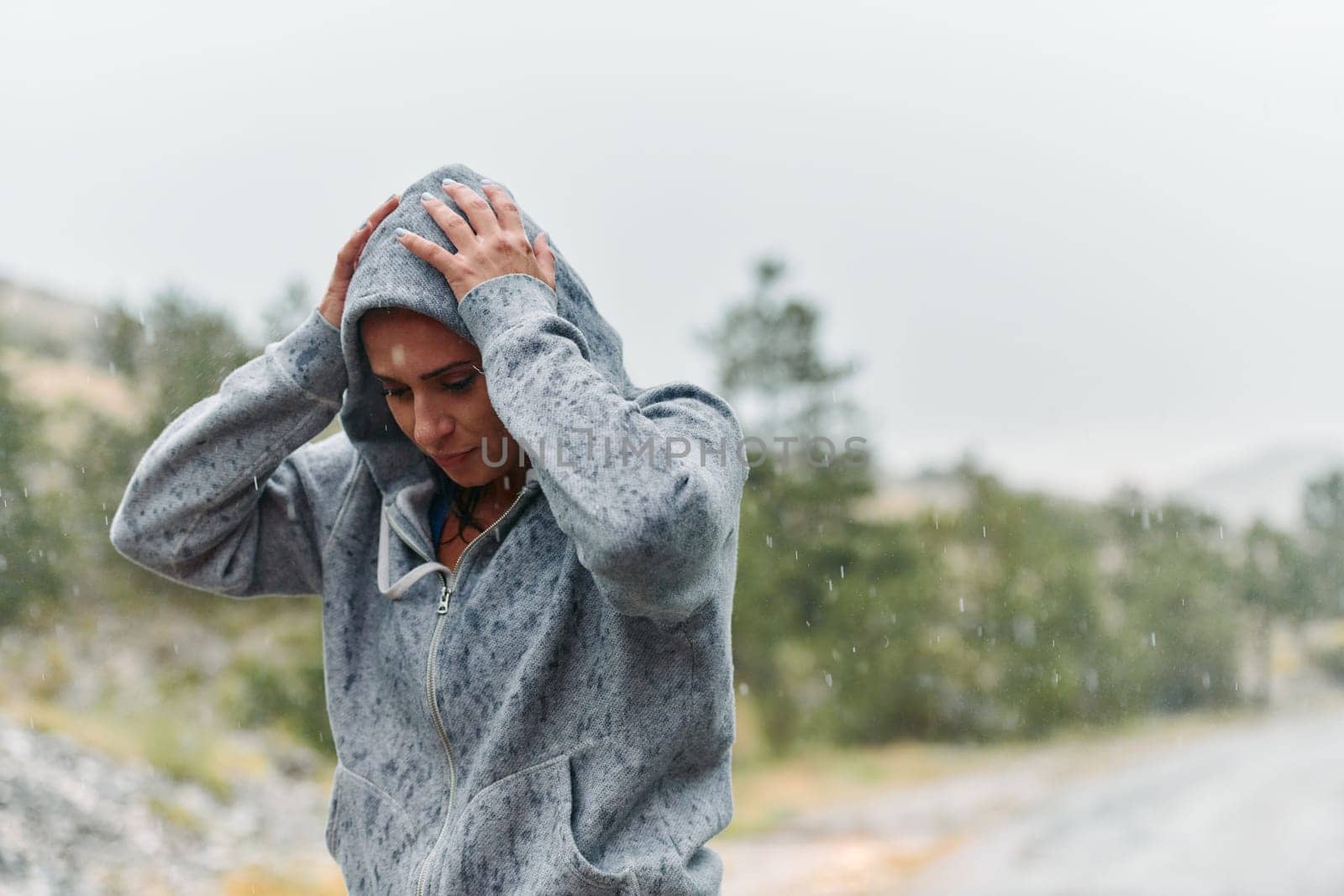 Woman Resting in the Rain After Intense Run by dotshock