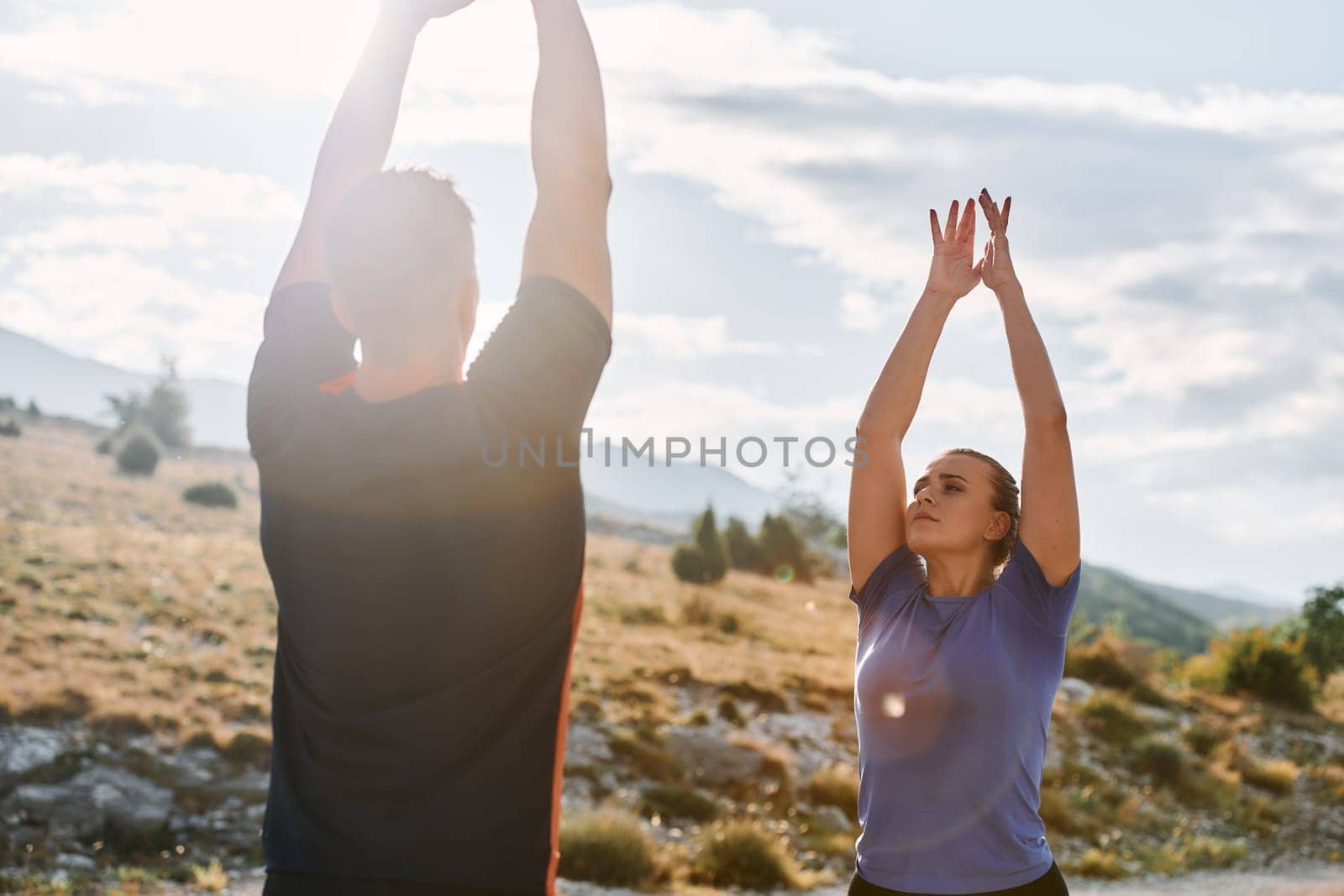 A couple engages in post-run stretching, fostering flexibility and recovery after an intense morning jog, promoting health and well-being in their fitness routine