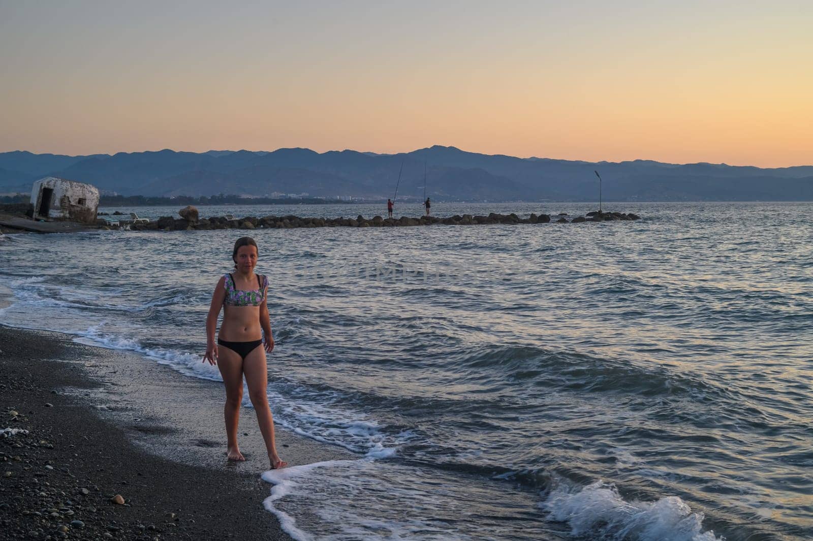 girl walking along the beach at sunset 1 by Mixa74