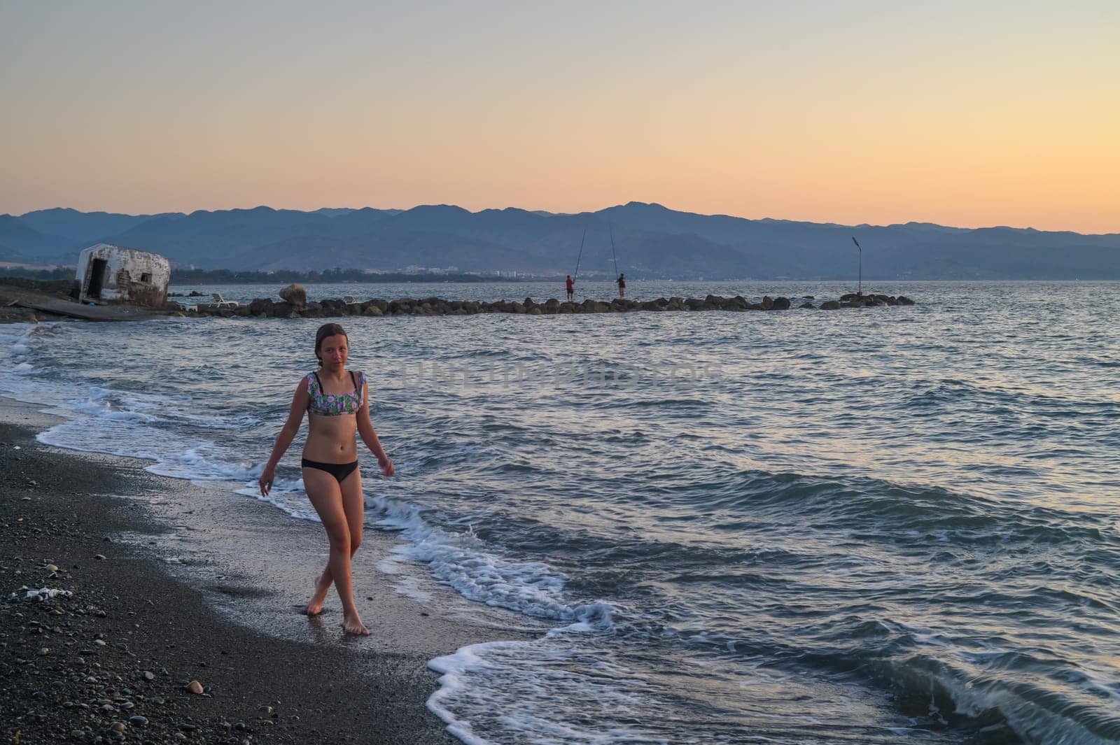 girl walking on the beach at sunset in Cyprus by Mixa74