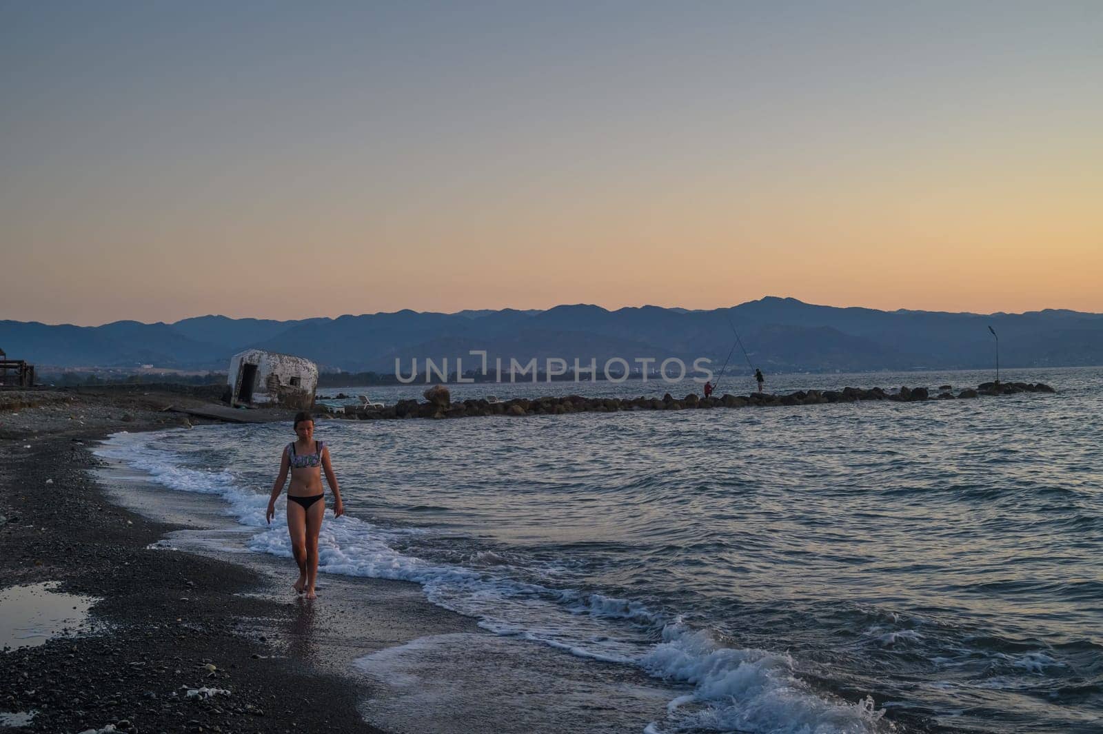 child walking on the beach at sunset in Cyprus 1