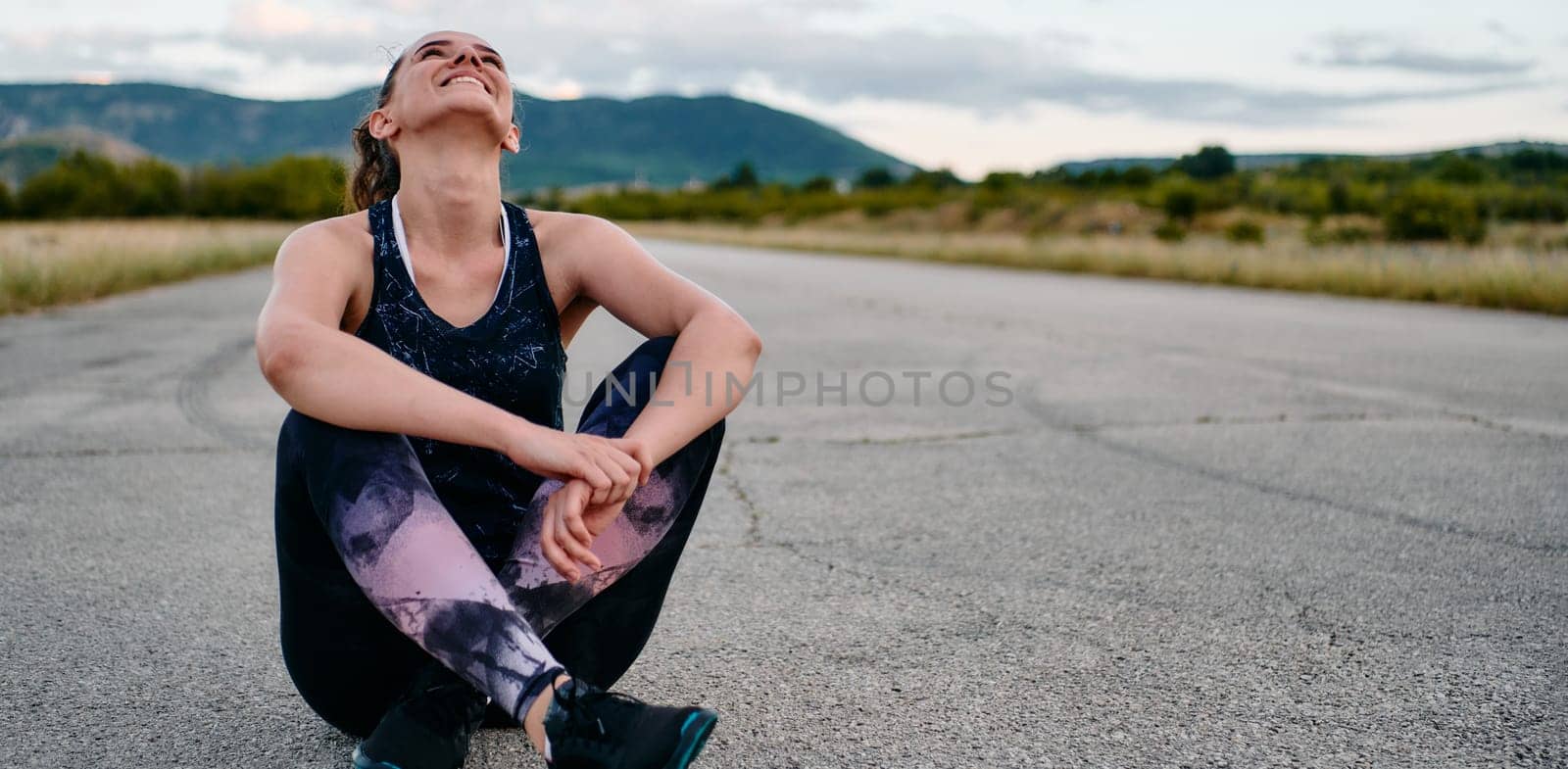 An athletic woman prepares herself for a morning run, embodying dedication and determination in her fitness routine