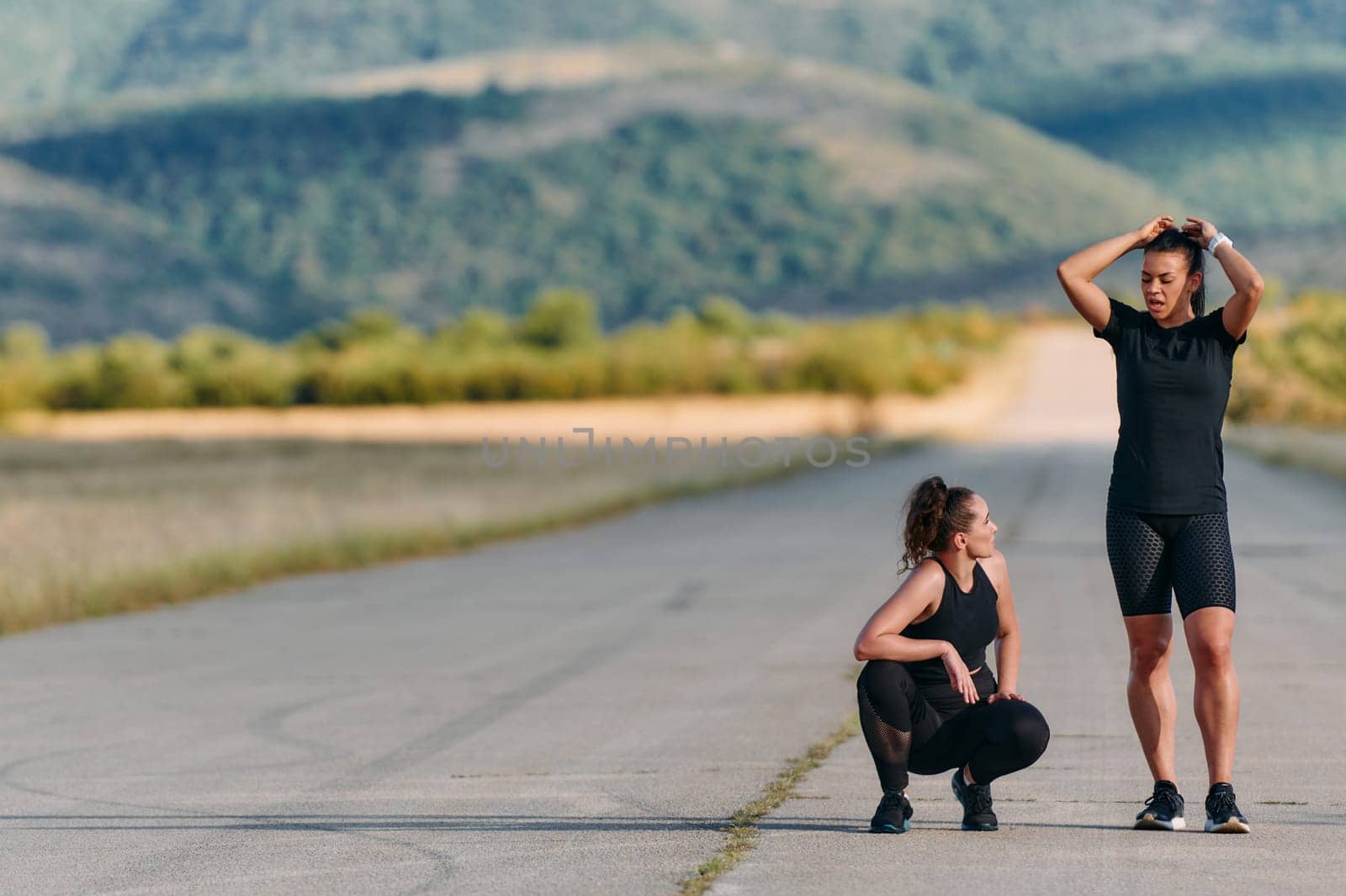 Two friends are depicted resting and sharing a sense of accomplishment after their invigorating morning run