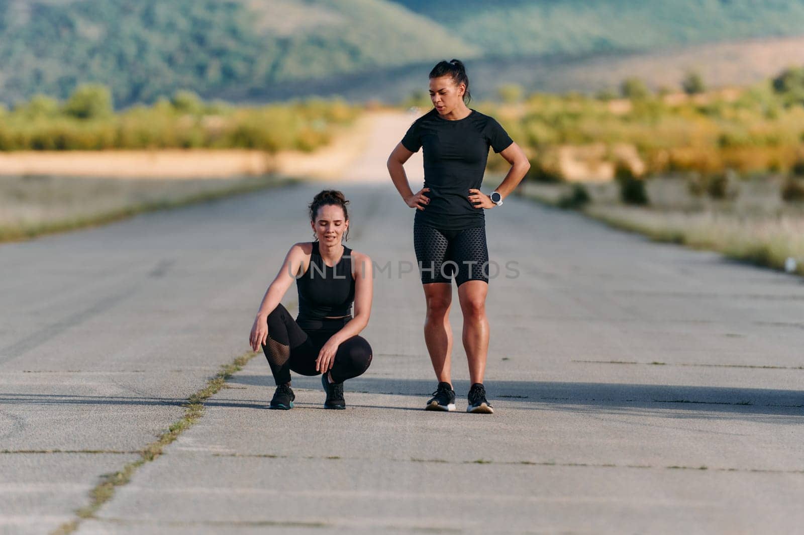 Two friends are depicted resting and sharing a sense of accomplishment after their invigorating morning run