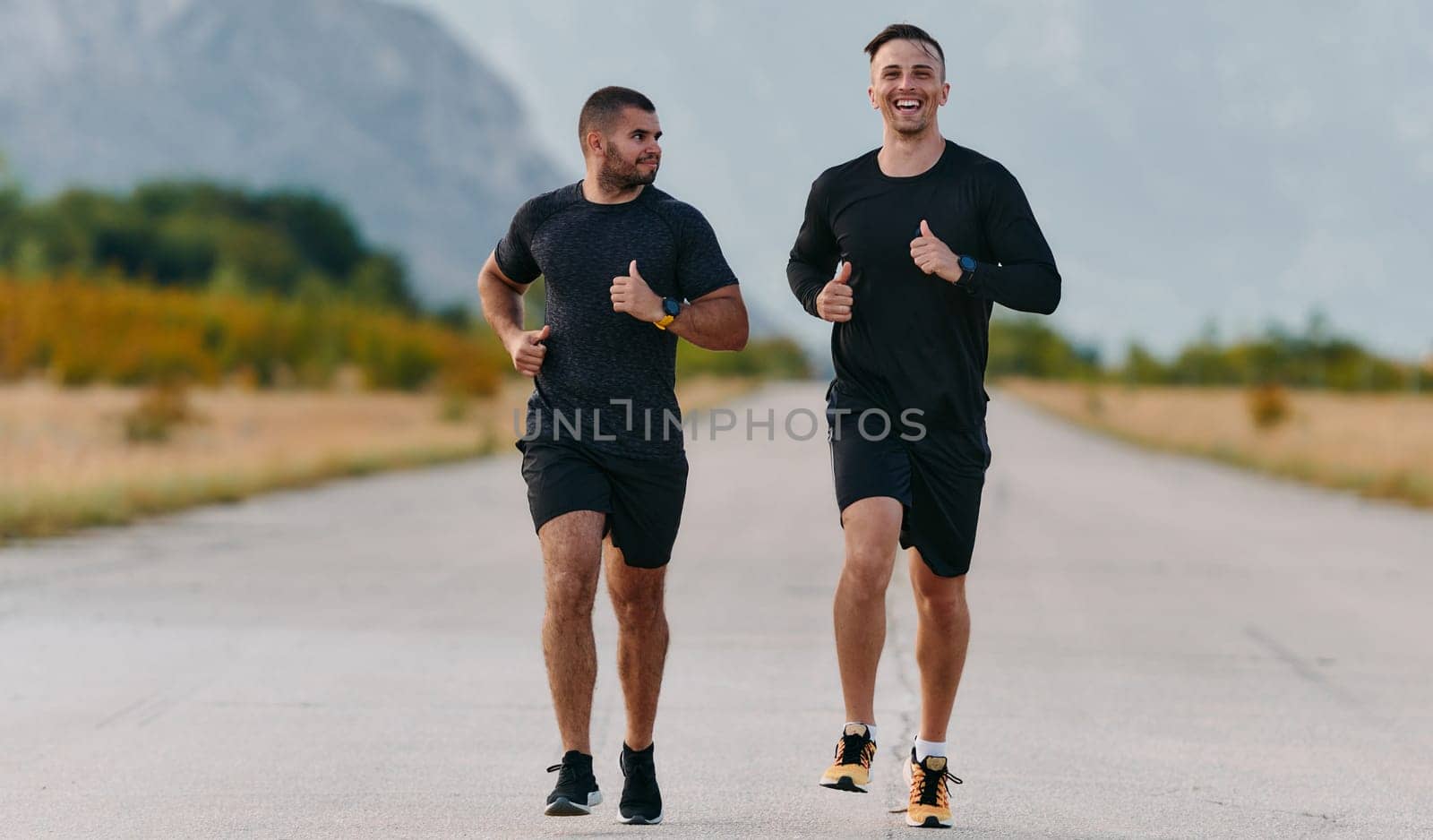 Two Friends Jogging Together on a Beautiful Sunny Day by dotshock