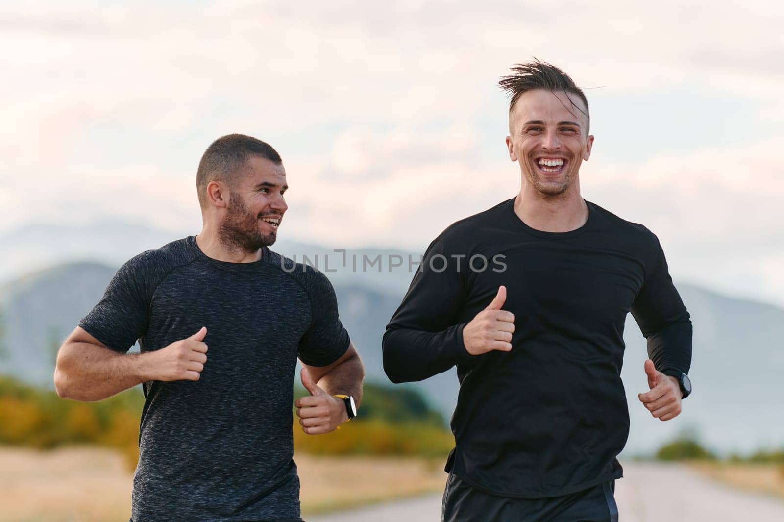 Two Friends Jogging Together on a Beautiful Sunny Day by dotshock