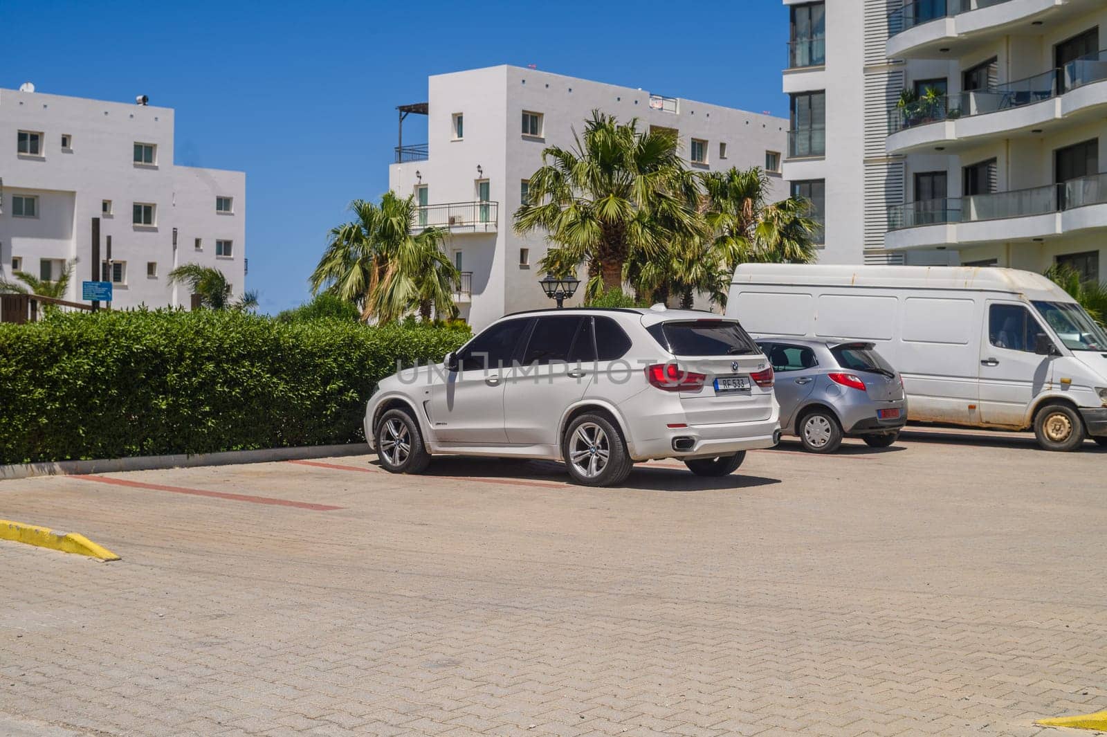 Gaziveren Cyprus 05.27.2024 - cars in the parking lot in a residential complex by Mixa74