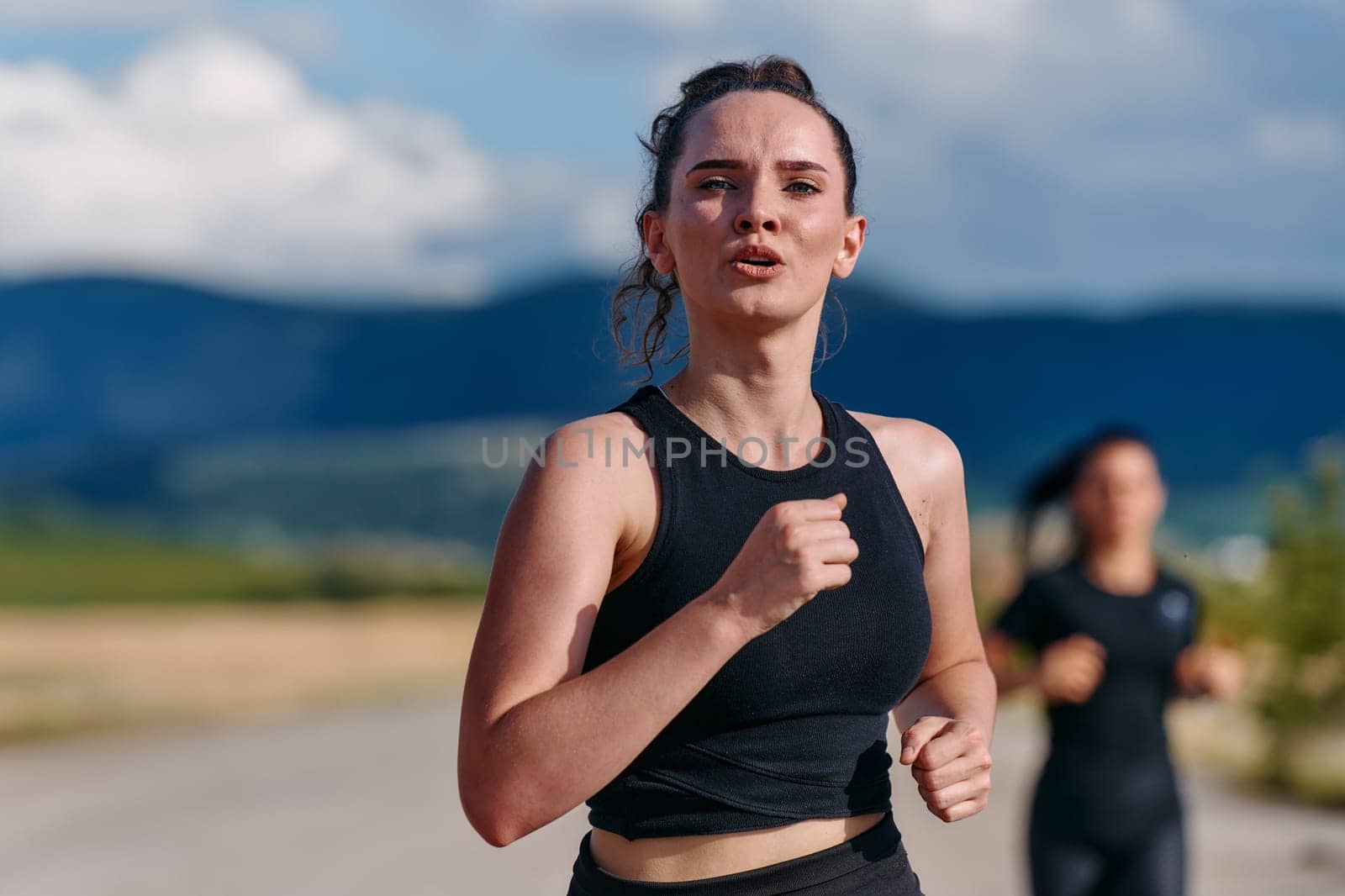 Two friends jog side by side on a sunny day, strengthening their bodies for life's extreme challenges, embodying the power of friendship and determination