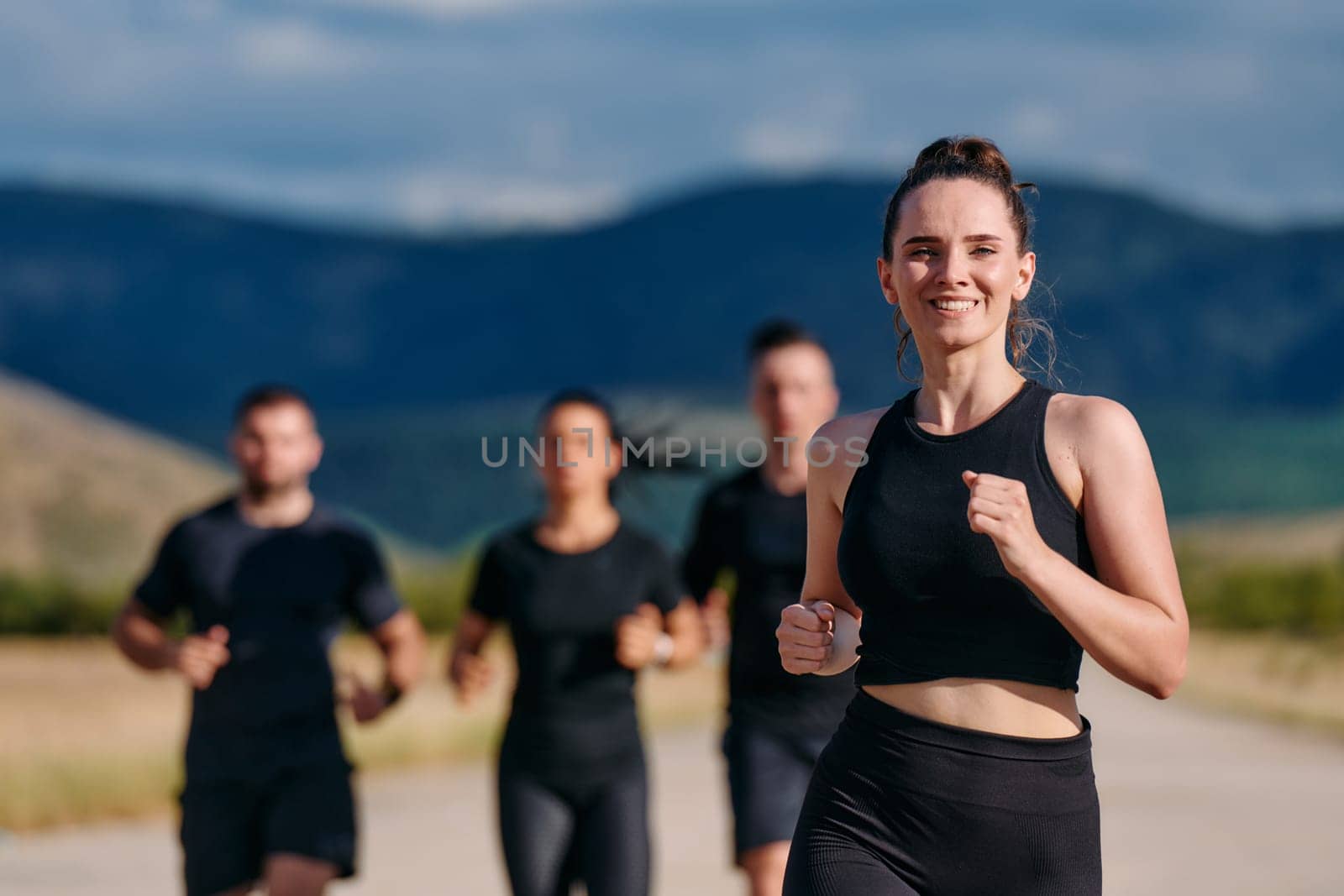 A professional athletic team as they train rigorously, running towards peak performance in preparation for an upcoming marathon.